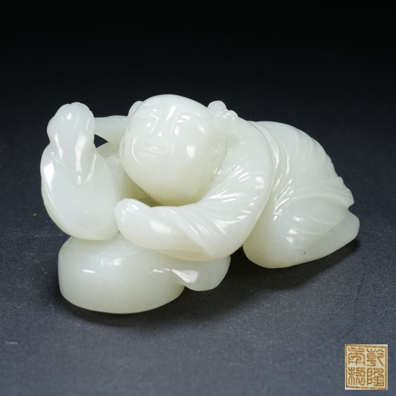 A HETIAN JADE JOYFUL BOY ORNAMENT: Hetian Jade Joyful Boy Ornament