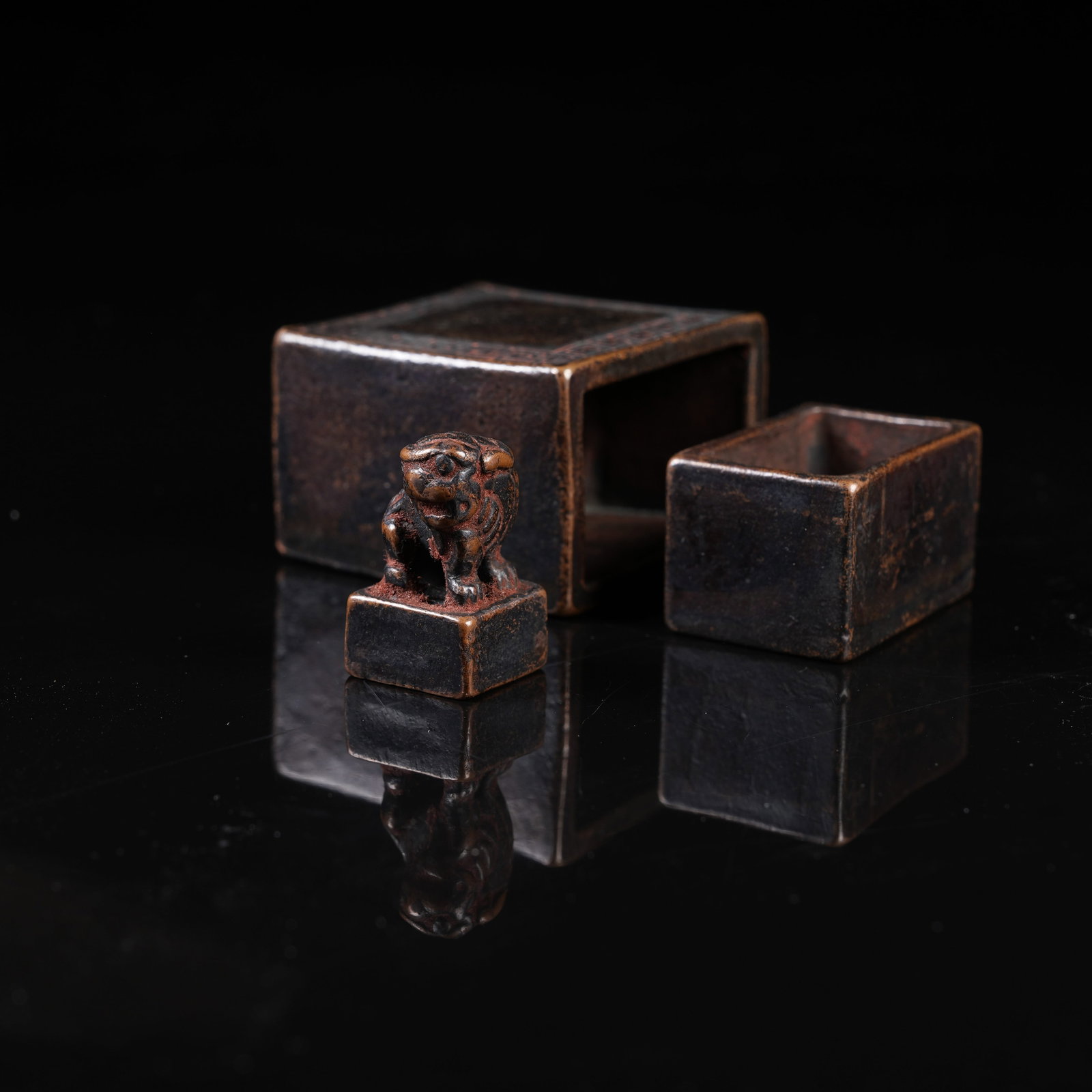 A SET OF NESTING BRONZE SEALS (1 of 9)