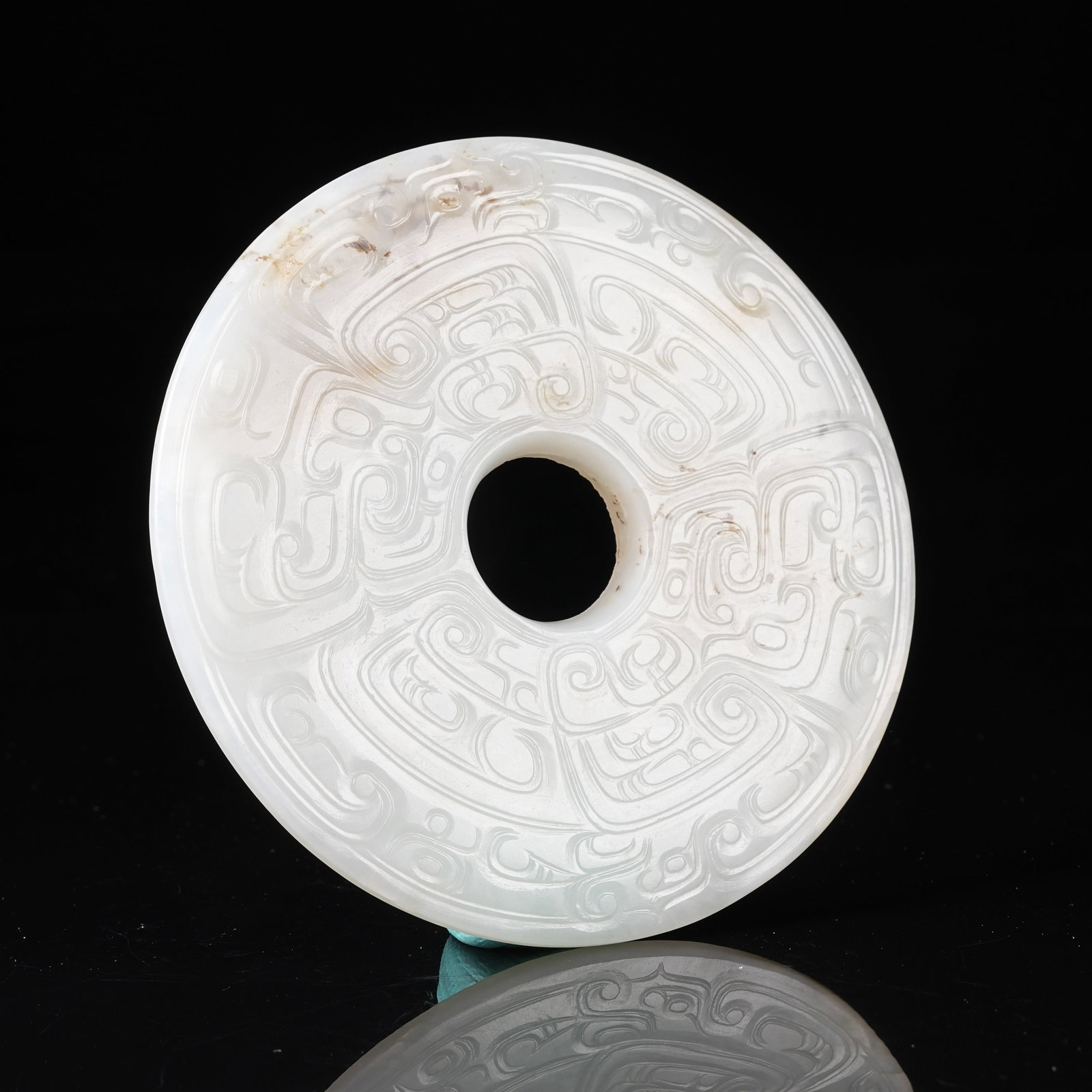 A NEPHRITE BI DISC WITH PHOENIX PATTERN (1 of 9)