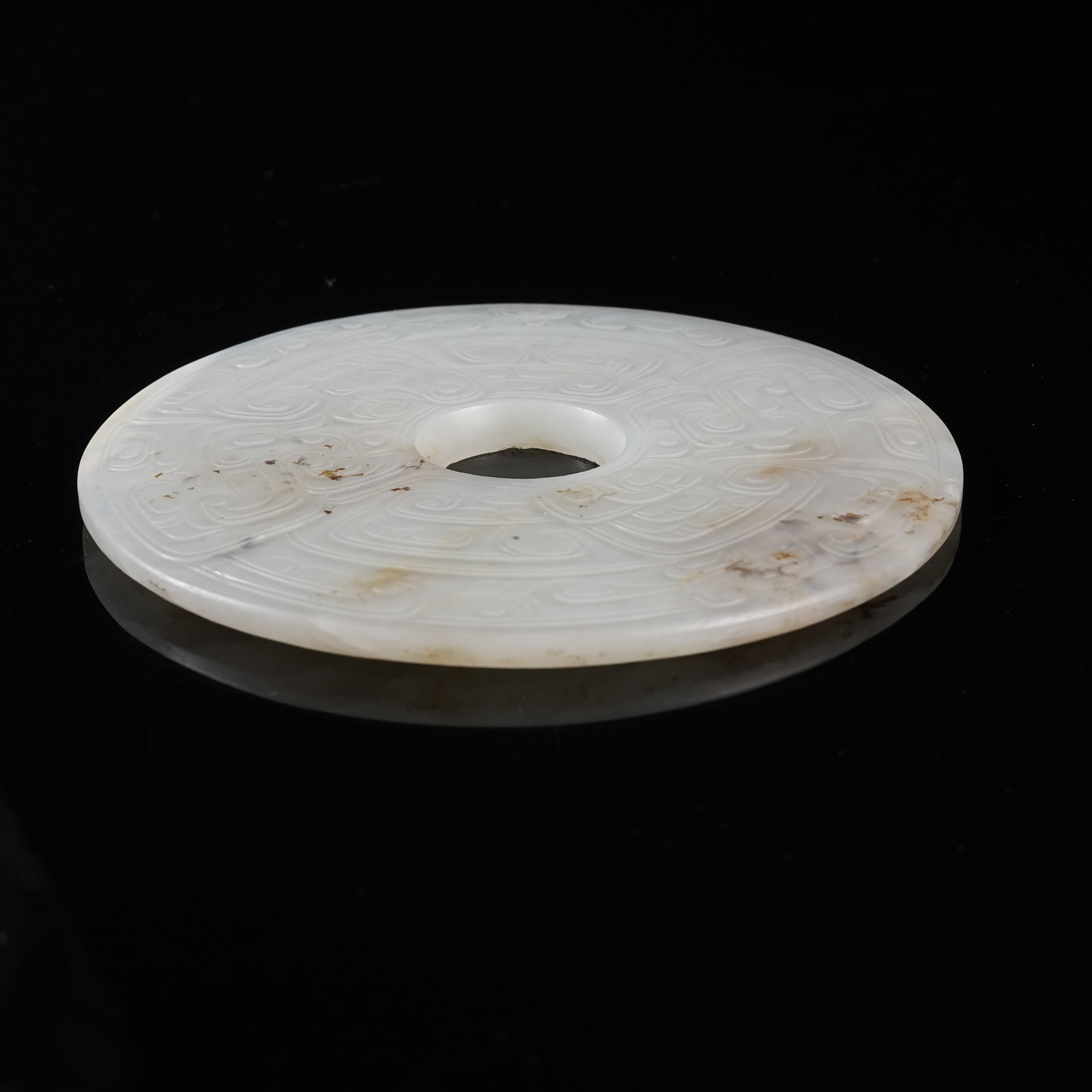 A NEPHRITE BI DISC WITH PHOENIX PATTERN - 9