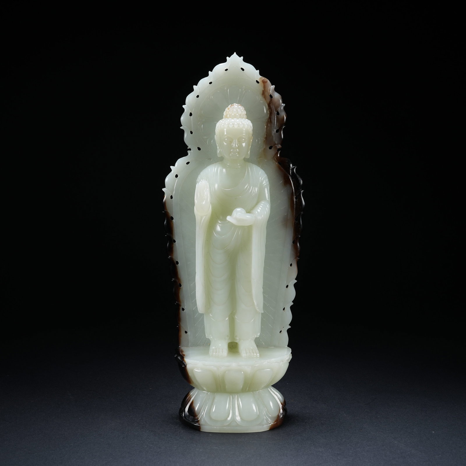 A HETIAN JADE VARIEGATED STANDING GUANYIN STATUE WITH LEFT-HAND PRAYER BEADS AND NIMBUS (1 of 9)