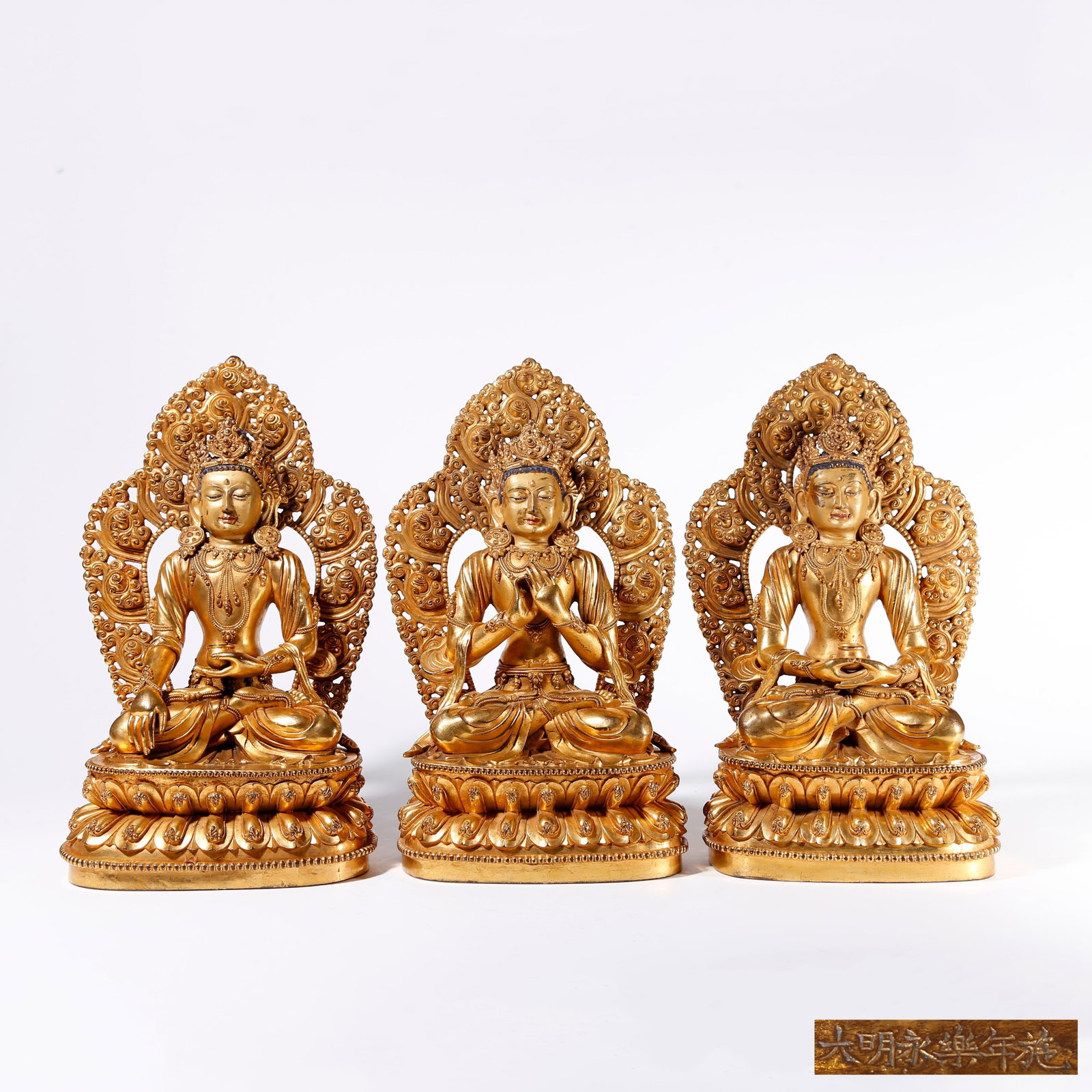 A SET OF GILT BRONZE STATUES OF THREE BUDDHAS (1 of 12)