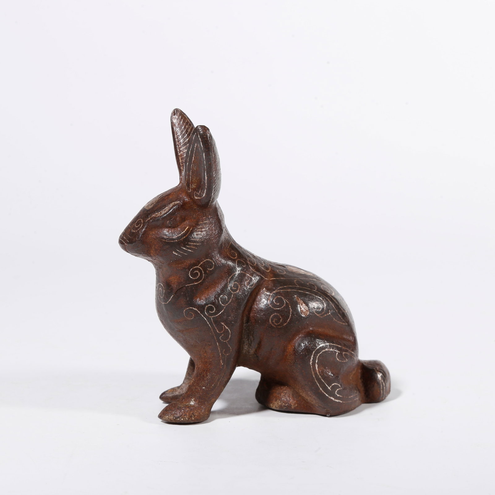 A IRON ORNAMENT WITH GOLD INLAY IN RABBIT FORM: Iron Ornament with Gold Inlay in Rabbit Form