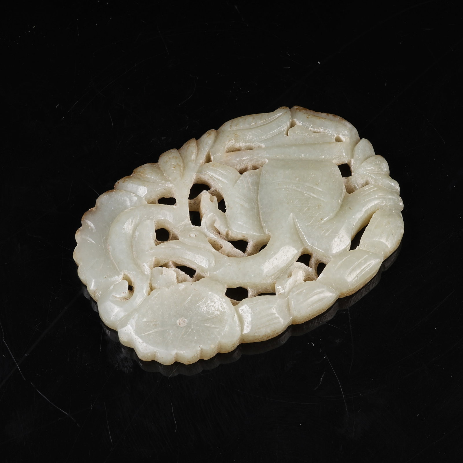 A MID-ANCIENT JADE PHOENIX ORNAMENT WITH FLORAL PIERCED CARVING: Mid-Ancient Jade Phoenix Ornament with Floral Pierced Carving
