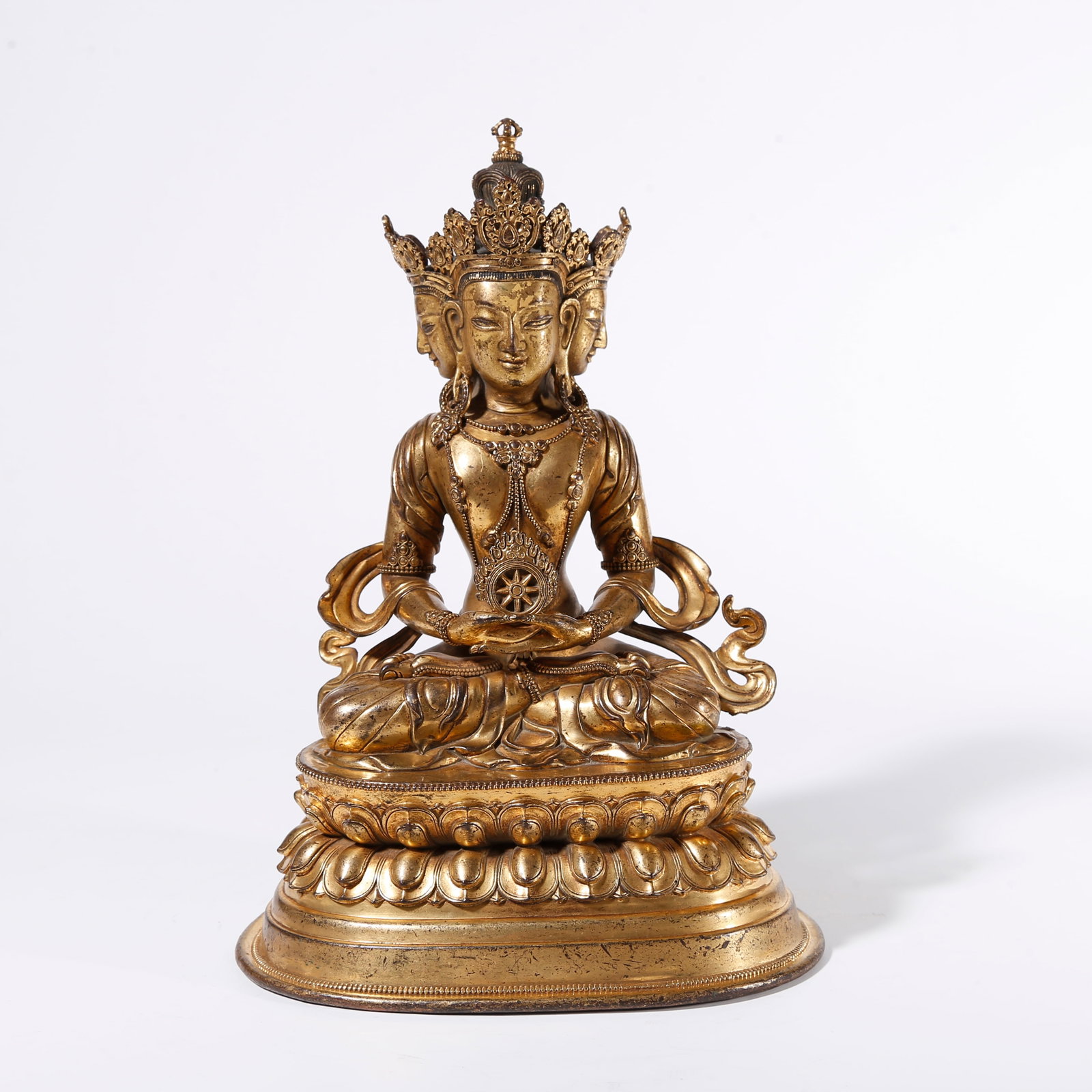 A GILT BRONZE FOUR-FACED VAIROCANA STATUE (1 of 9)