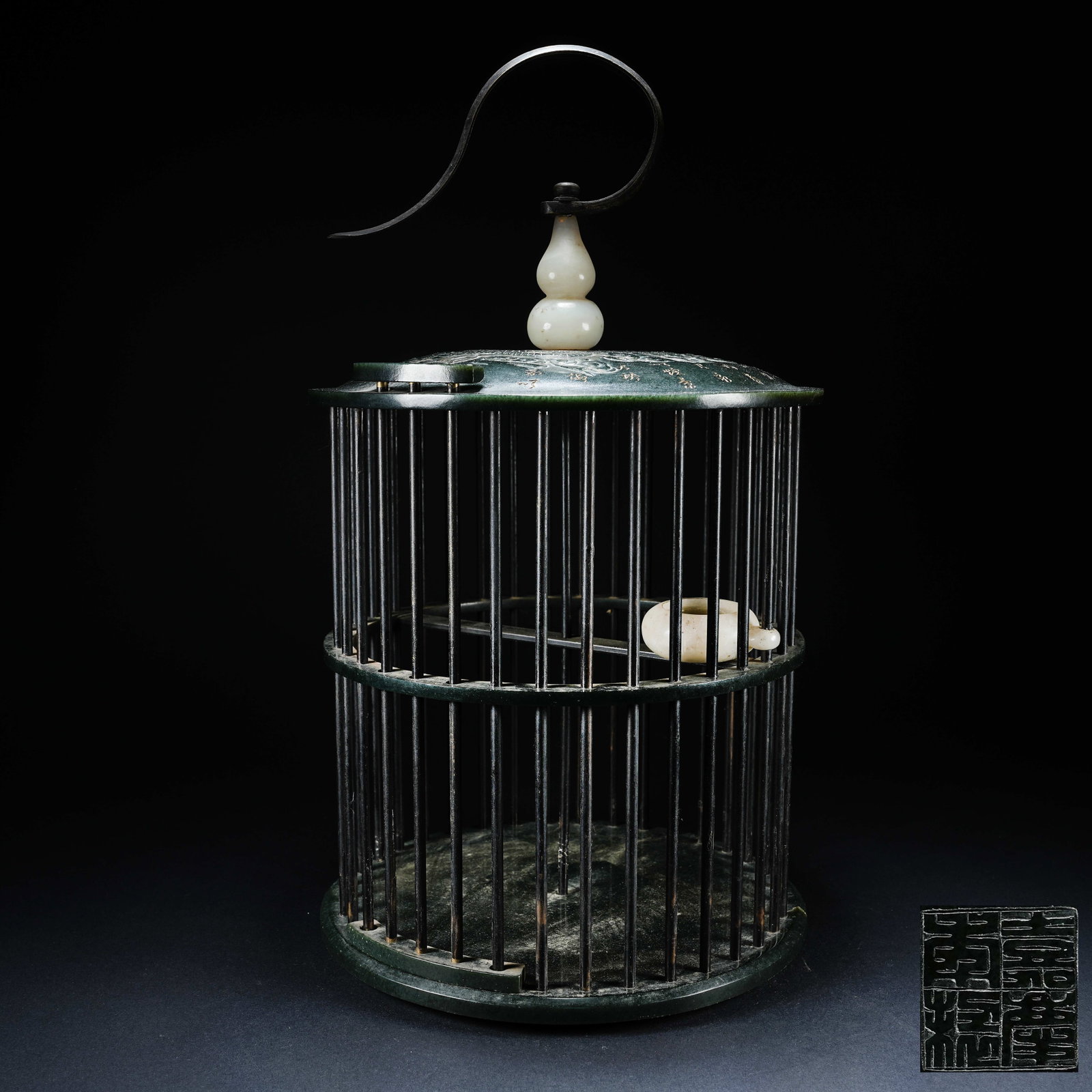 A WHITE HETIAN JADE BIRD CAGE CARVED WITH POETRY AND DRAGON PATTERN: White Hetian Jade Bird Cage Carved with Poetry and Dragon Pattern
