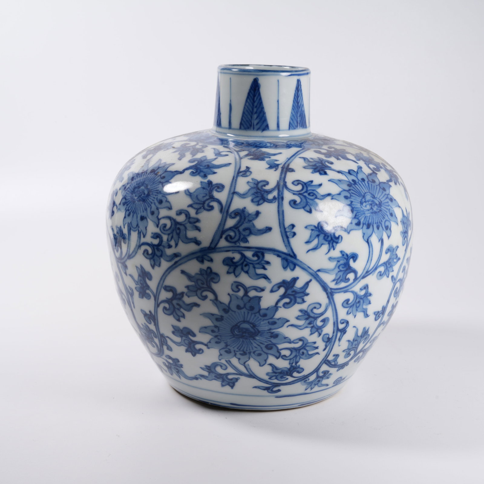 A BLUE AND WHITE JAR WITH INTERLOCKING FLORAL PATTERN: Blue and White Jar with Interlocking Floral Pattern