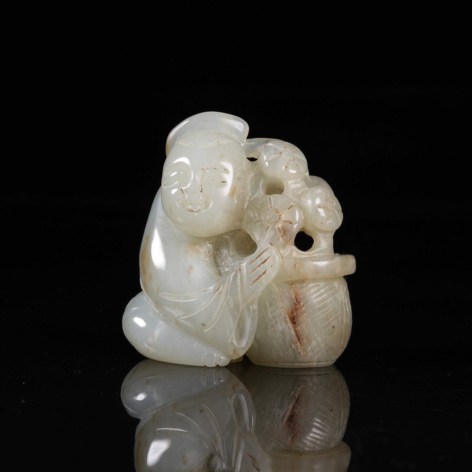 A NEPHRITE ORNAMENT OF MA GU PRESENTING LONGEVITY: Nephrite Ornament of Ma Gu Presenting Longevity