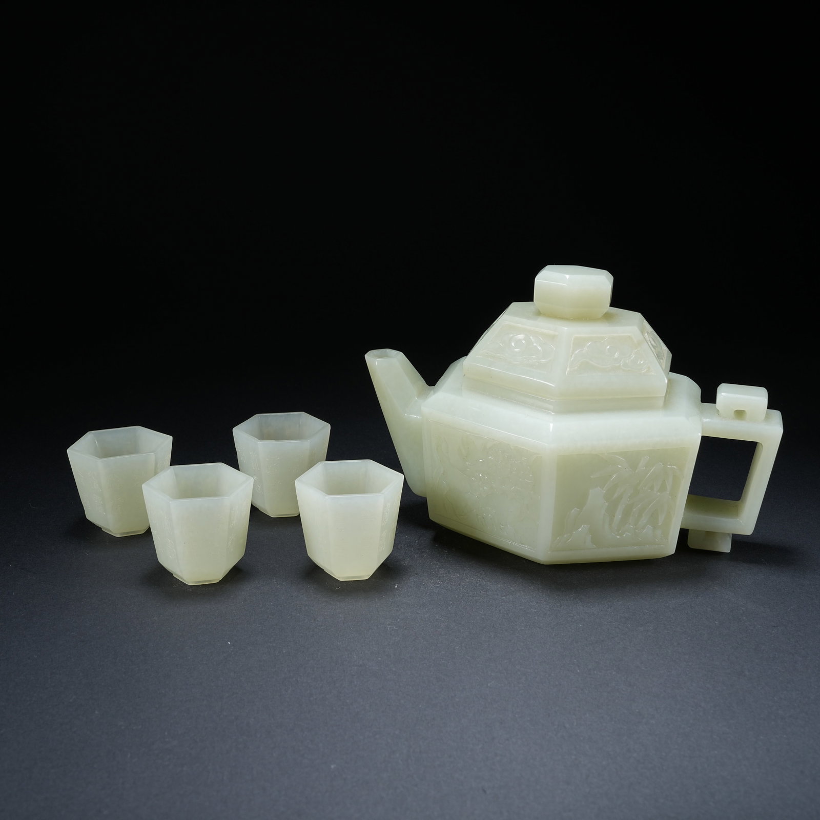 A HEXAGONAL HETIAN JADE EWER SET CARVED WITH PLUM, ORCHID, BAMBOO AND CHRYSANTHEMUM INSCRIPTIONS (1 of 9)