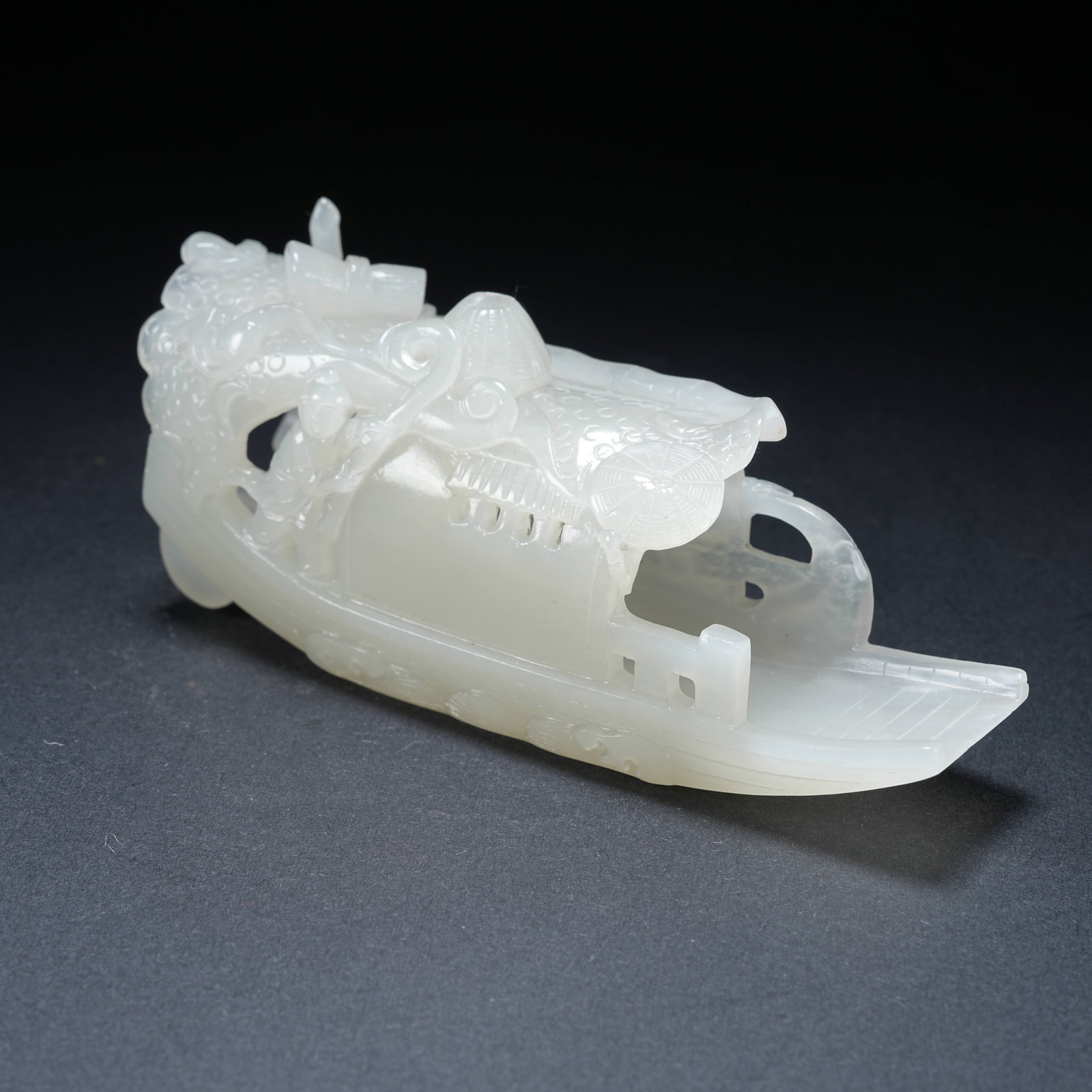 A HETIAN JADE BOY AND FISHING BOAT ORNAMENT: Hetian Jade Boy and Fishing Boat Ornament