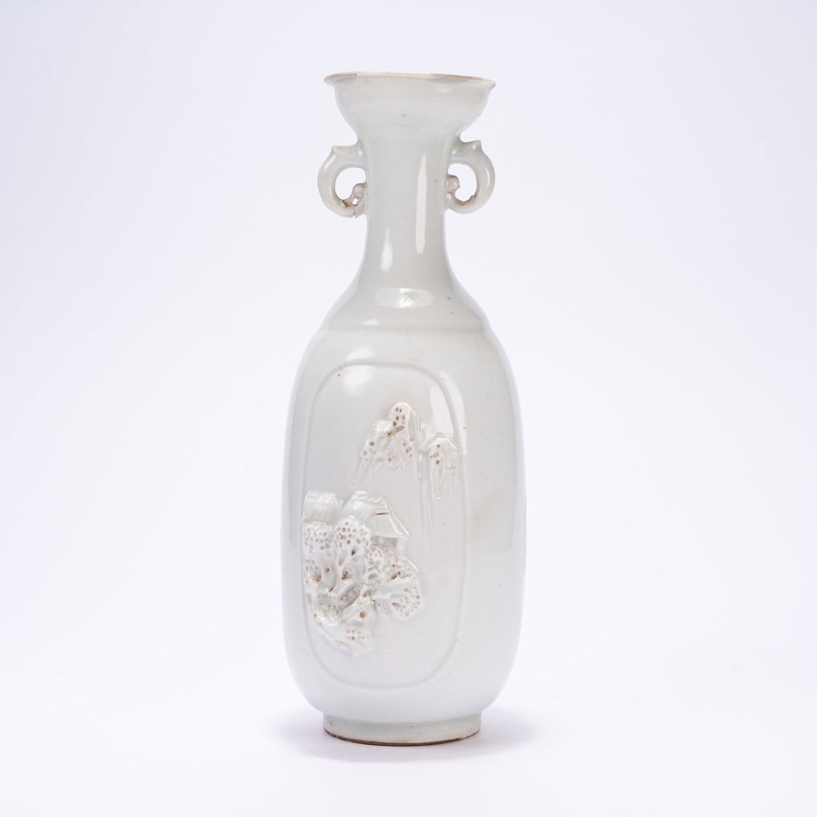 A WHITE GLAZED DECORATIVE VASE WITH MOULDED LANDSCAPE AND PAVILION DESIGN: White Glazed Decorative Vase with Moulded Landscape and Pavilion Design