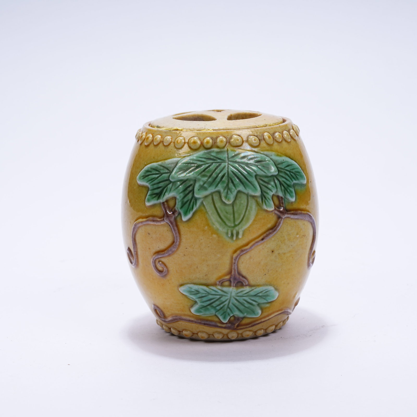 A PLAIN TRICOLOR DRUM STOOL WITH LOTUS LEAF PATTERN: Plain Tricolor Drum Stool with Lotus Leaf Pattern