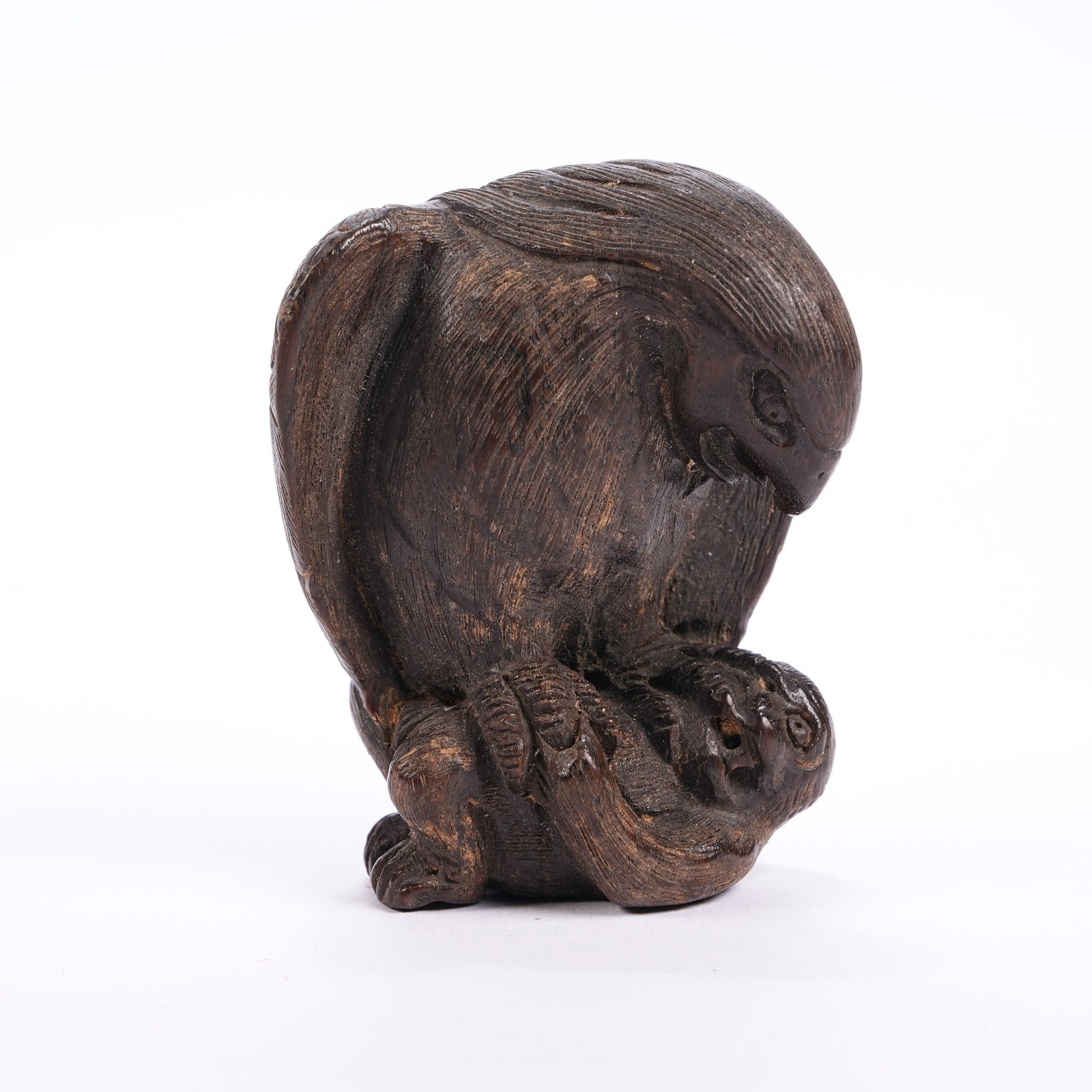 A YELLOW PEAR WOOD EAGLE AND MONKEY ORNAMENT (1 of 7)