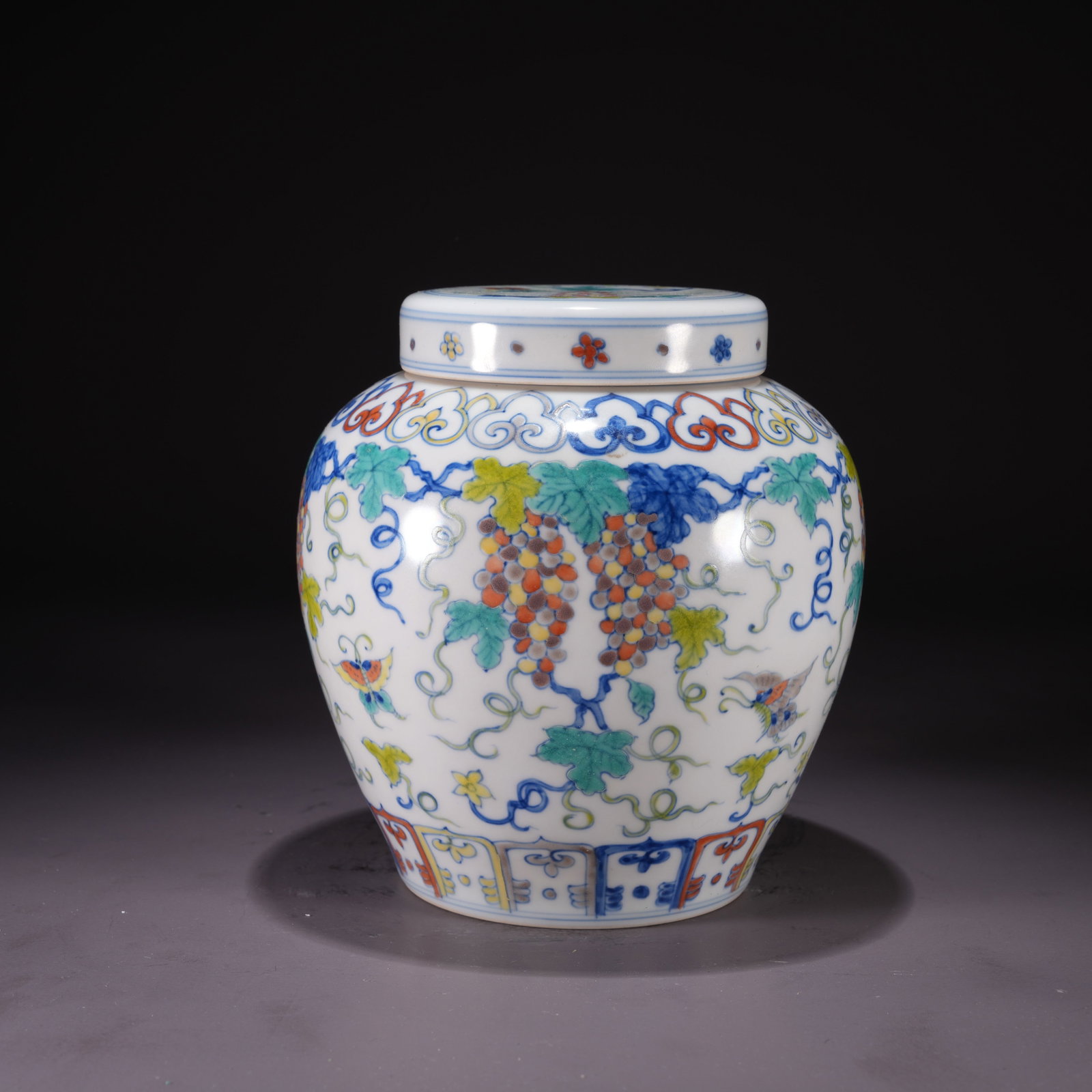 A DOUCAI JAR WITH FLORAL AND BUTTERFLY MOTIF AND "TIAN" MARK: Doucai Jar with Floral and Butterfly Motif and "Tian" Mark