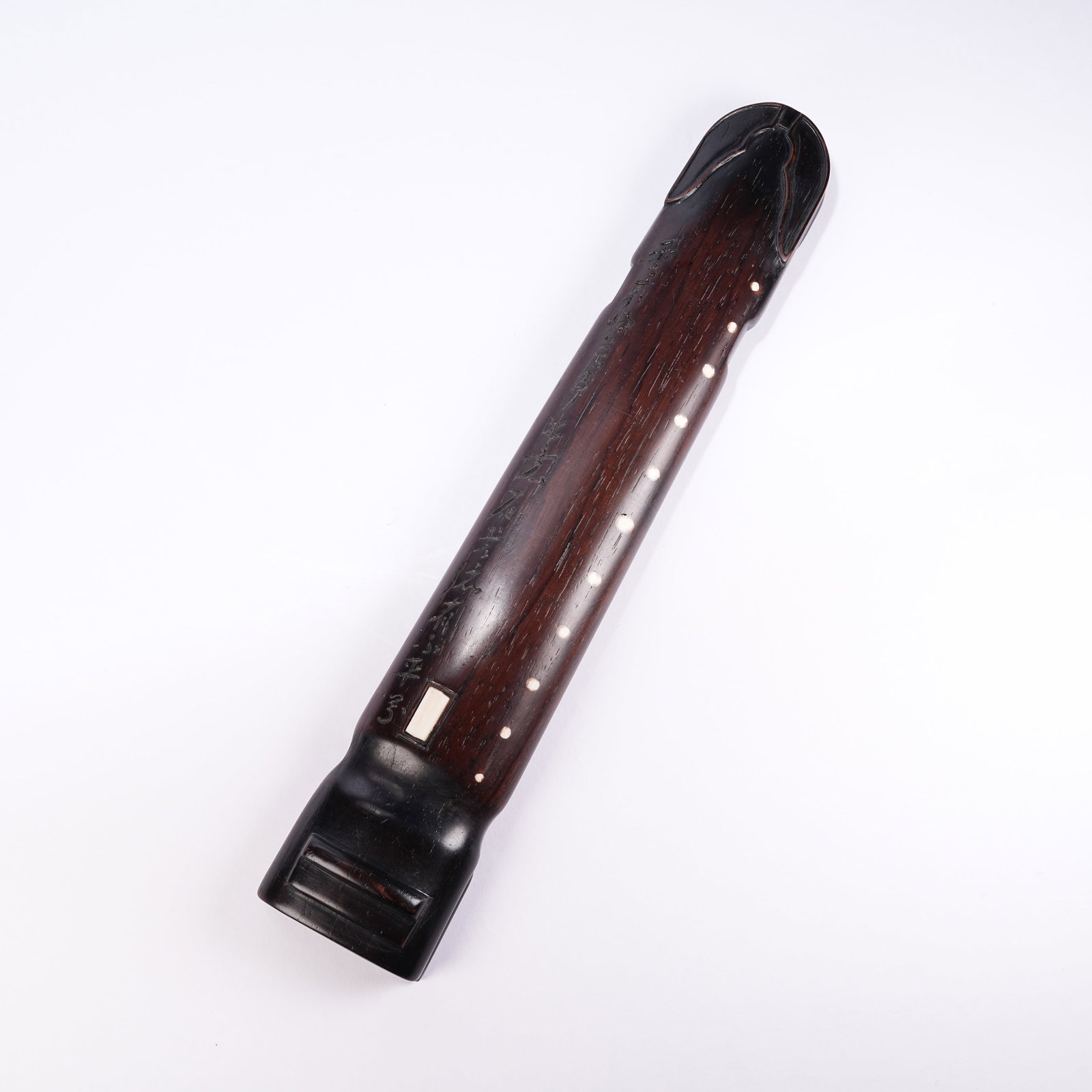 A RED SANDALWOOD ZITHER-SHAPED PAPERWEIGHT (1 of 9)