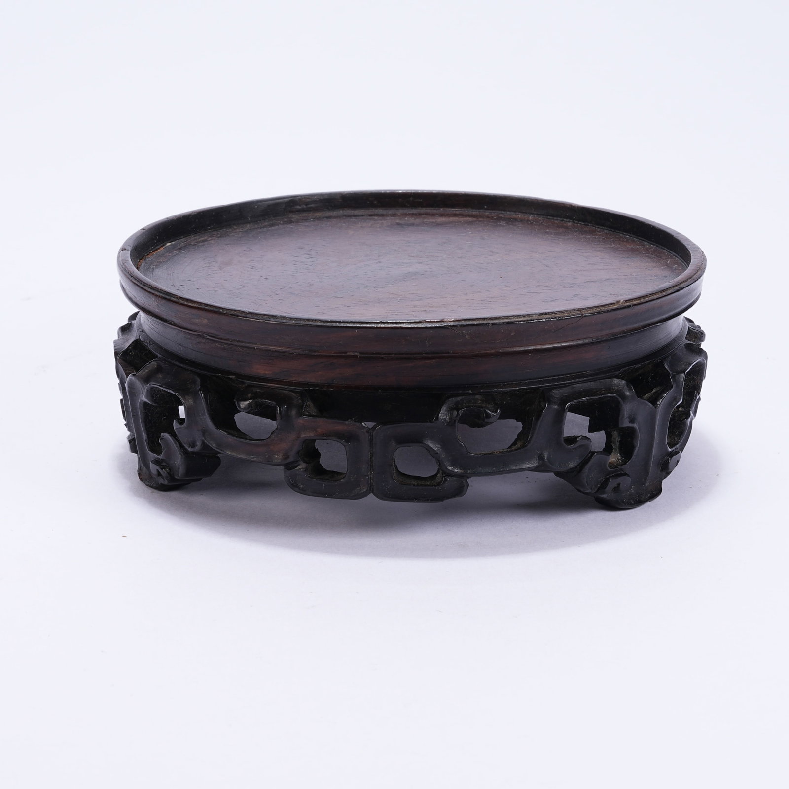 A ROUND HUANGHUALI STAND: Round Huanghuali Stand