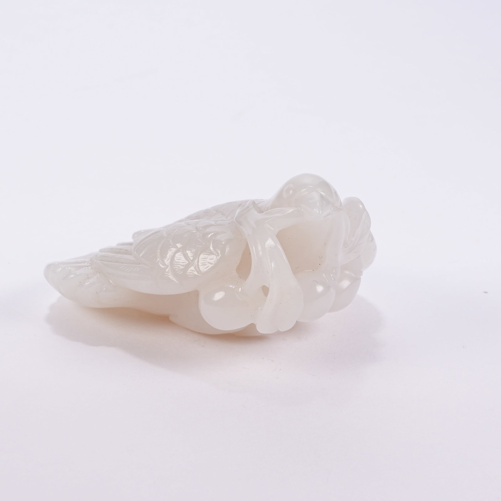 A WHITE HETIAN JADE LONGEVITY OFFERING PHOENIX PENDANT (1 of 8)
