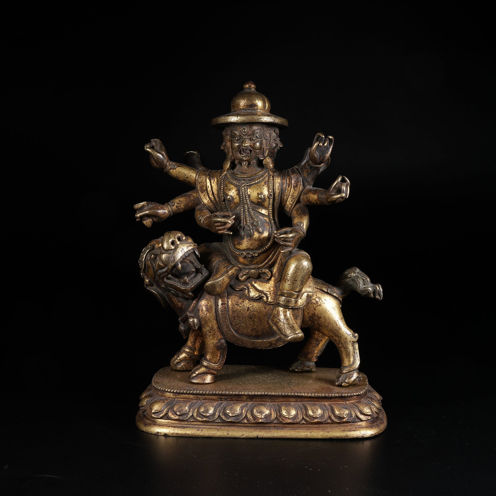 A GILDED BRONZE SIX-ARMED WRATHFUL DEITY STATUE: Gilded Bronze Six-armed Wrathful Deity Statue