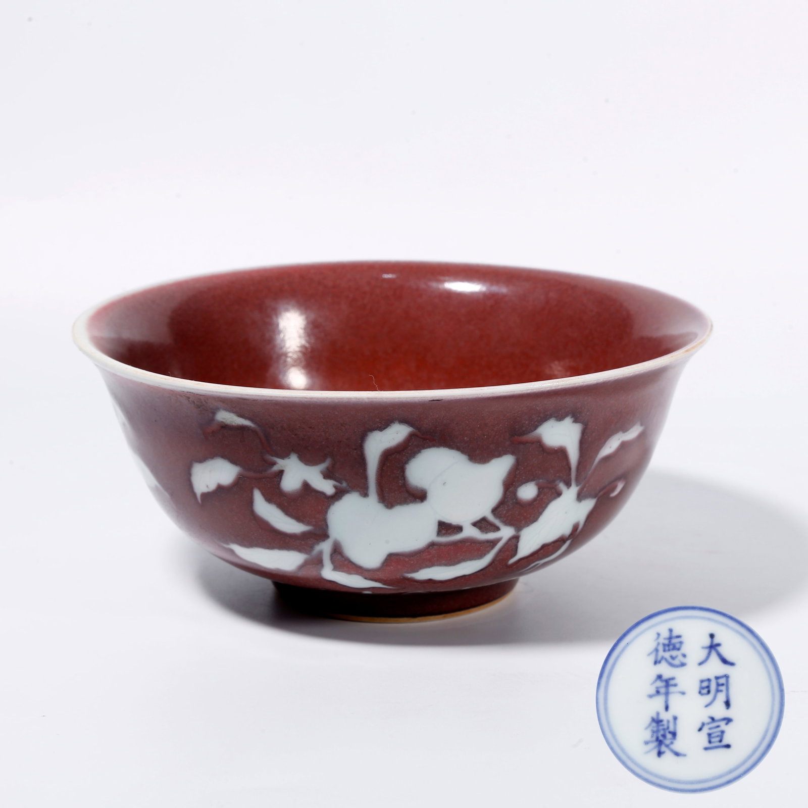 A RED GLAZE BOWL WITH RESERVED WHITE DESIGNS (1 of 9)