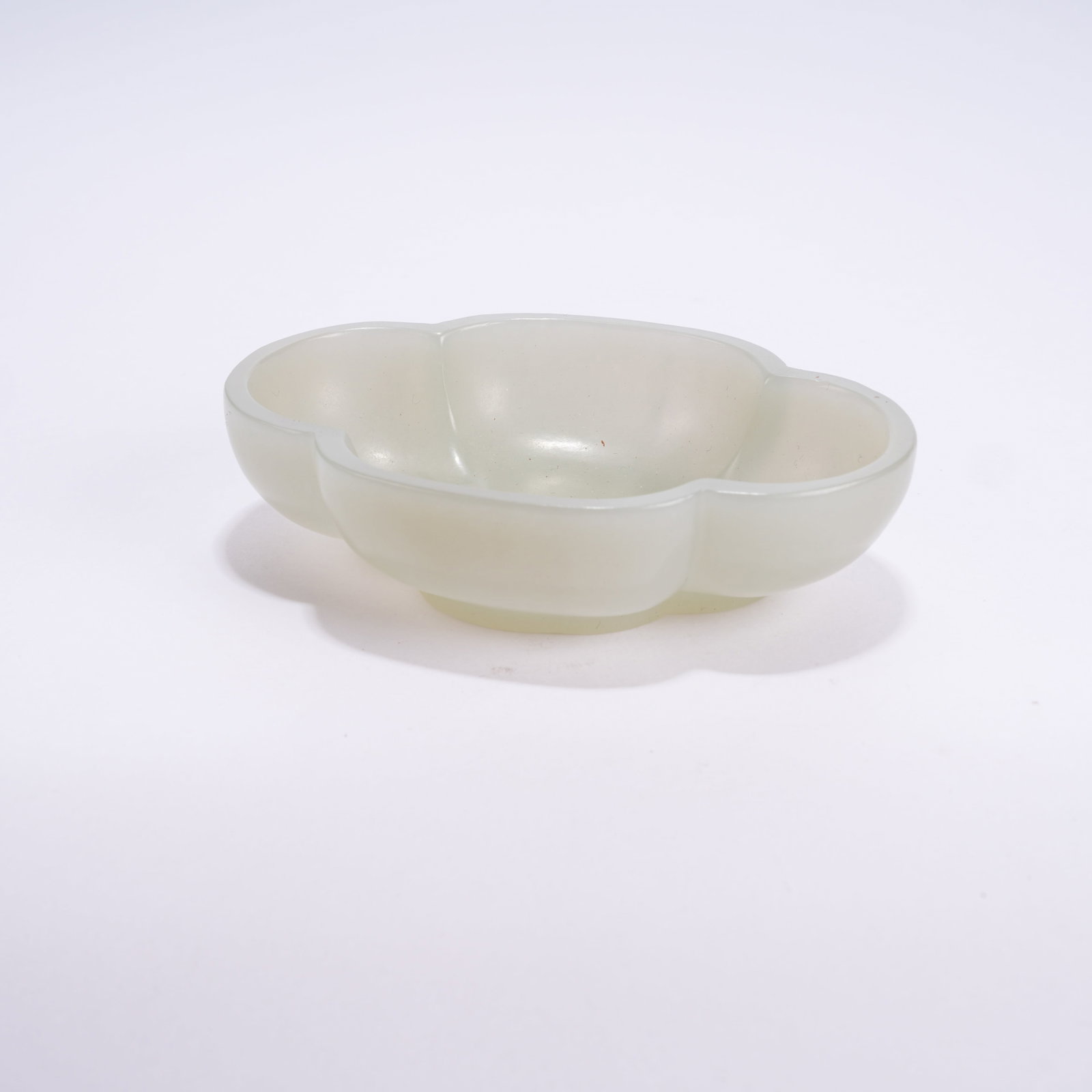A HETIAN JADE FLORAL-RIMMED WASHER: Hetian Jade Floral-rimmed Washer