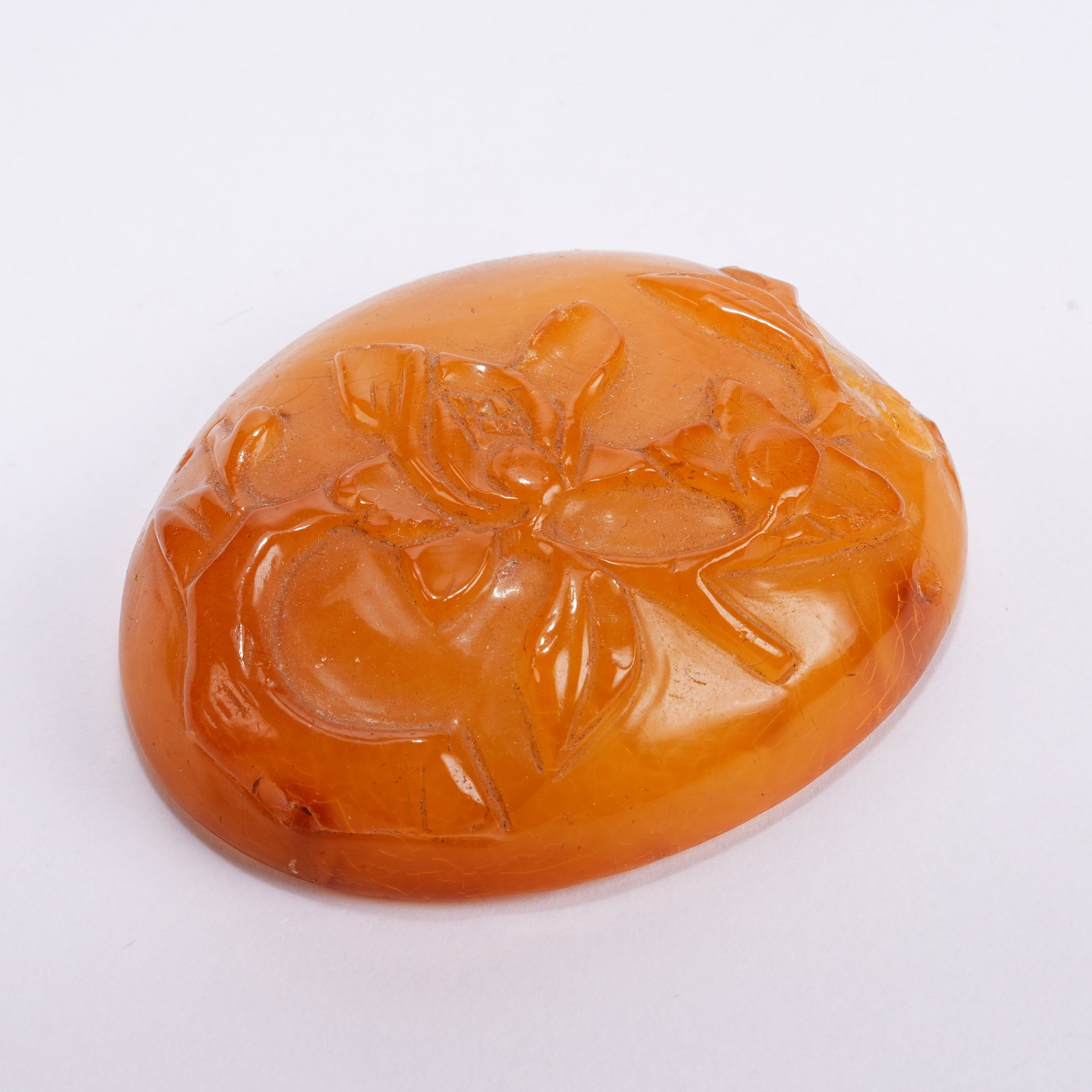 A BEESWAX FLORAL PATTERN BELT ORNAMENT: Beeswax Floral Pattern Belt Ornament