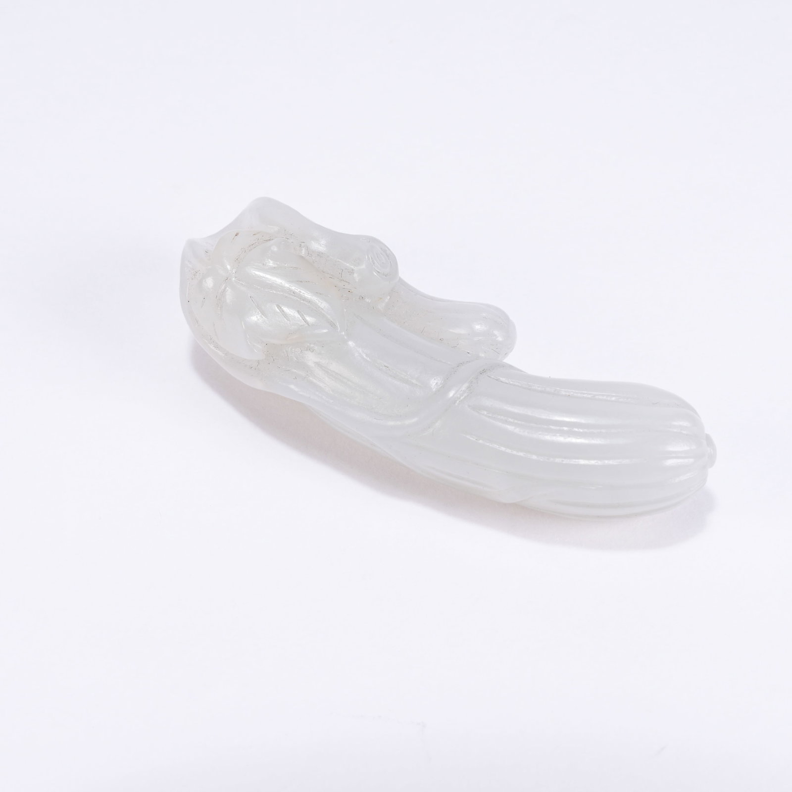 A HETIAN JADE AUSPICIOUS FRUIT PENDANT: Hetian Jade Auspicious Fruit Pendant
