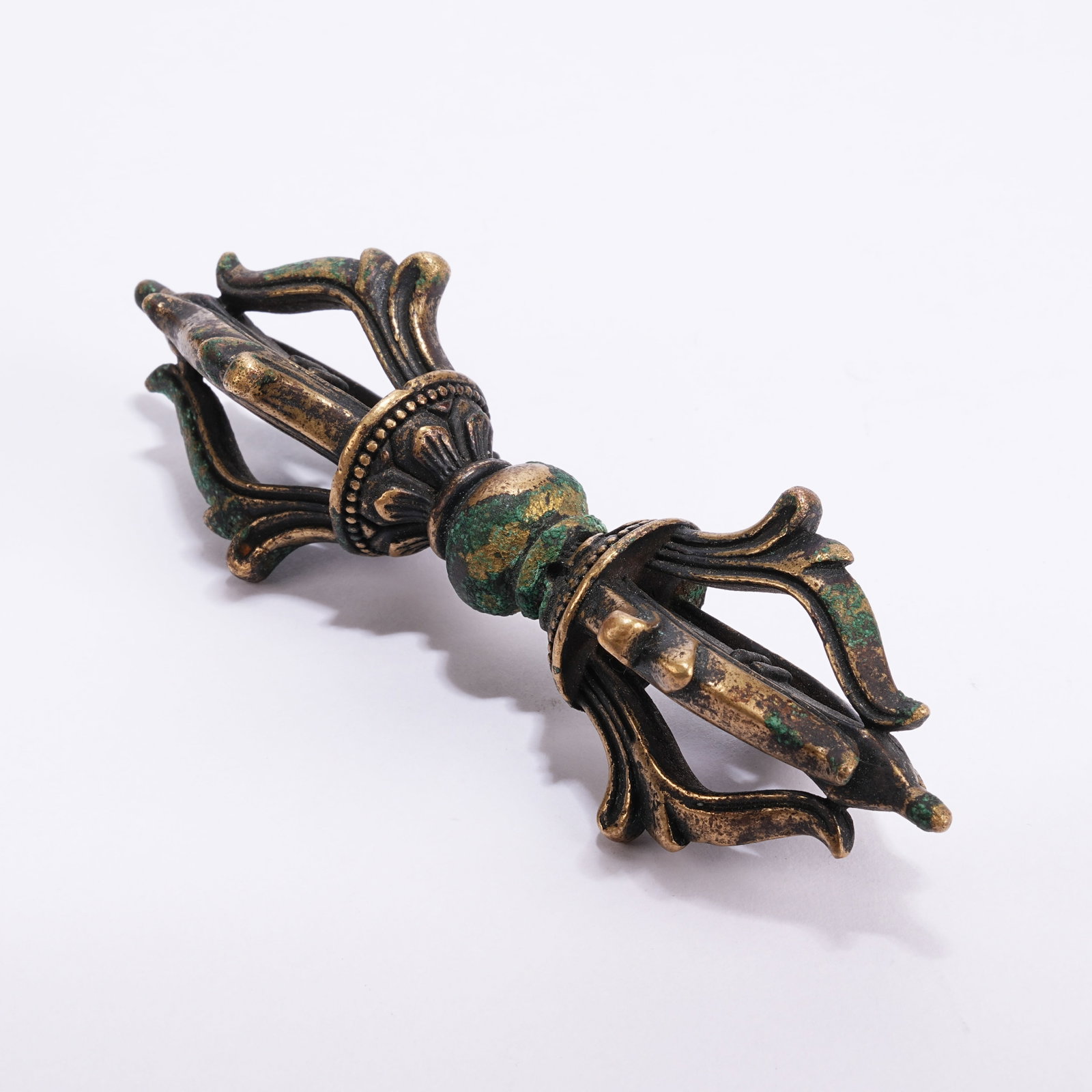 A BRONZE RITUAL IMPLEMENT: Bronze Ritual Implement