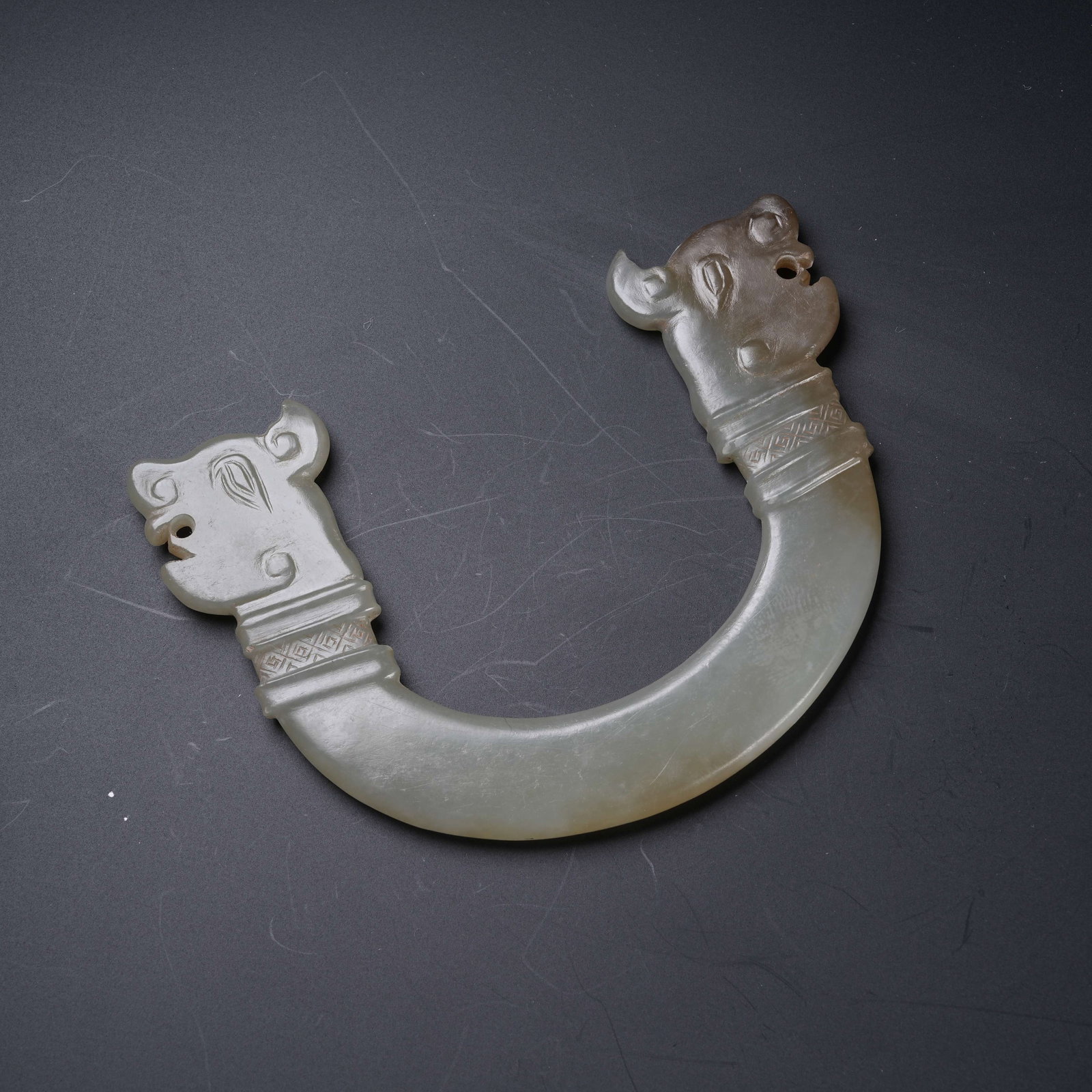 A ANCIENT JADE TWIN DRAGON PENDANT: Ancient Jade Twin Dragon Pendant