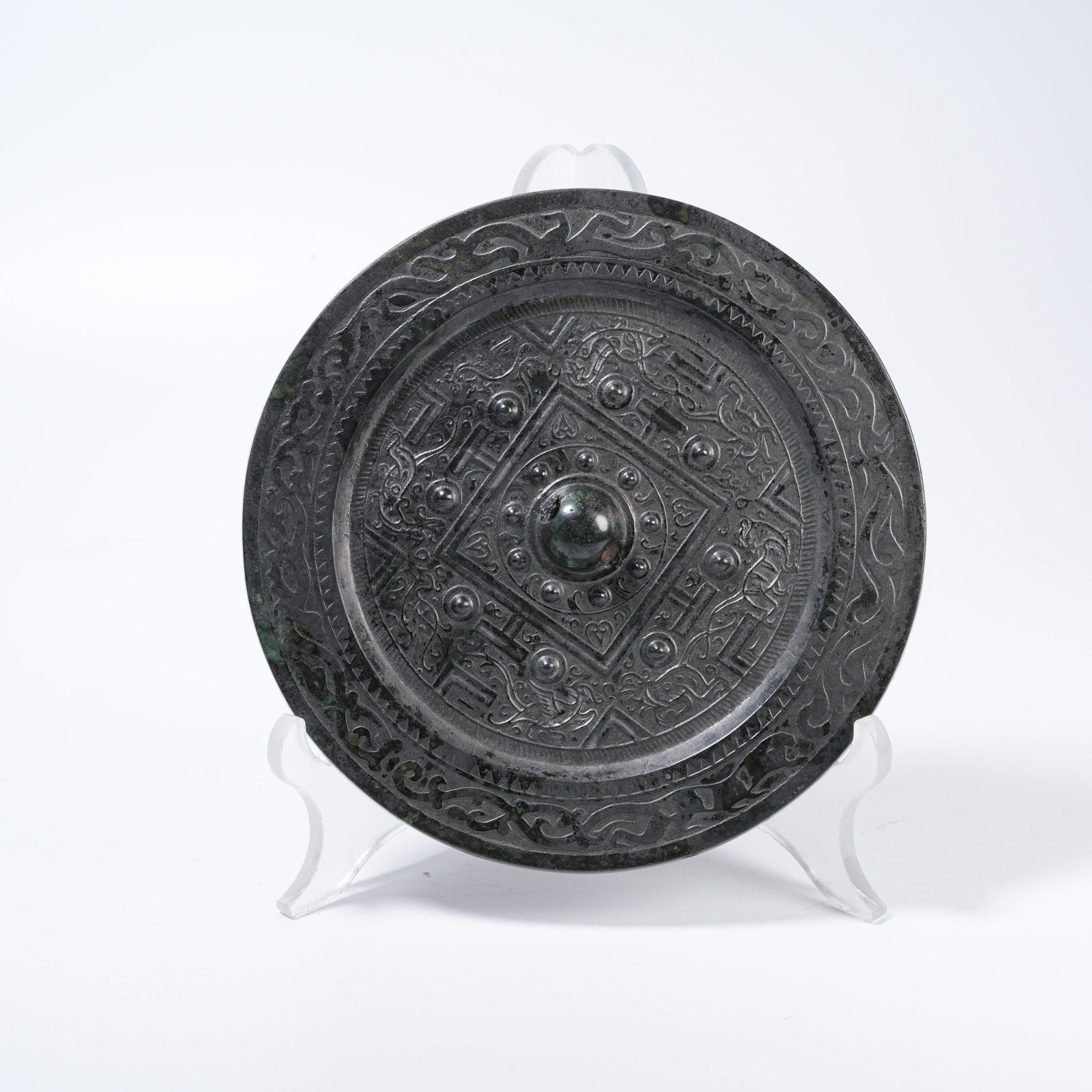 A BRONZE MIRROR WITH DRAGON AND PHOENIX PATTERNS: Bronze Mirror with Dragon and Phoenix Patterns