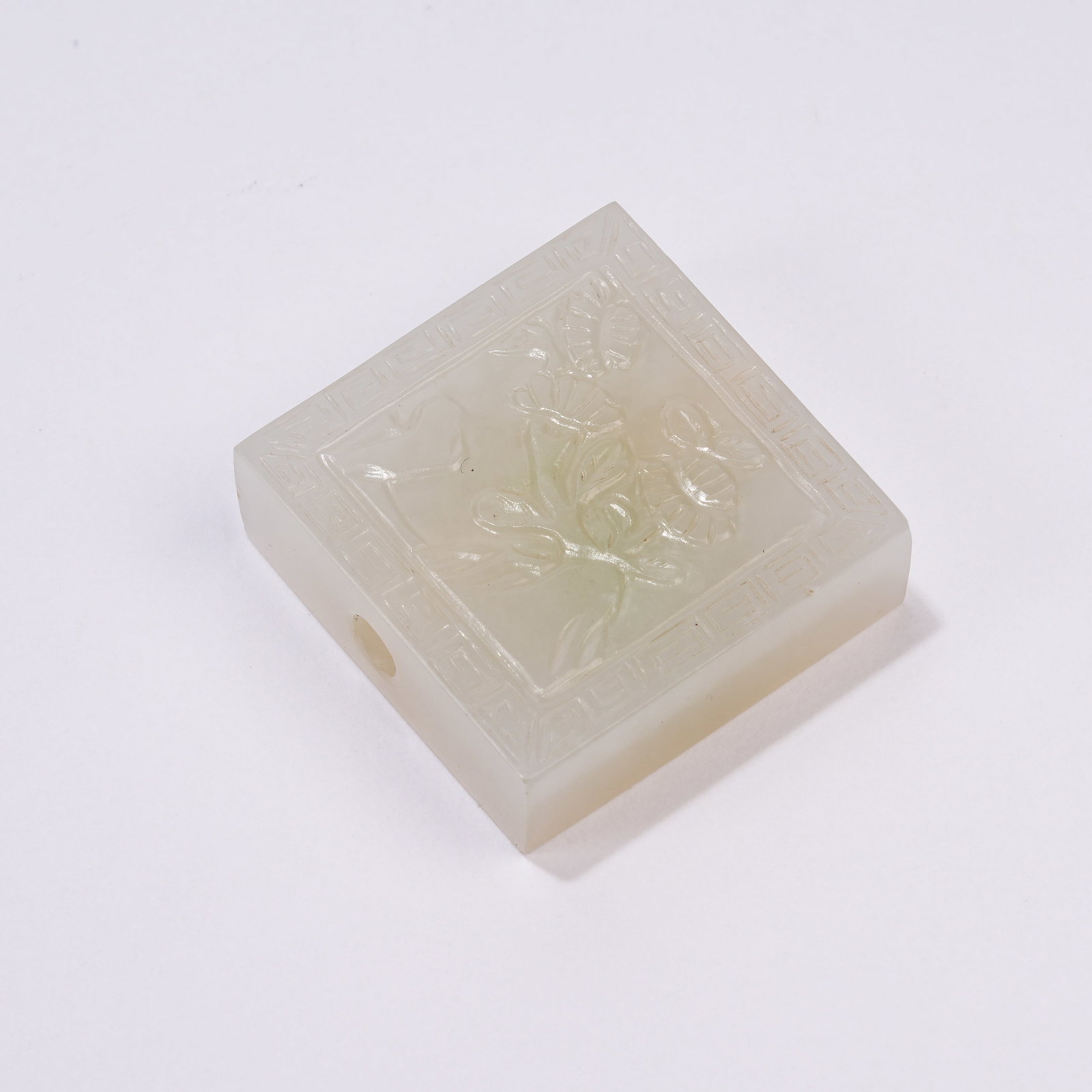 A HETIAN JADE FLOWER AND BUTTERFLY ORNAMENT: Hetian Jade Flower and Butterfly Ornament
