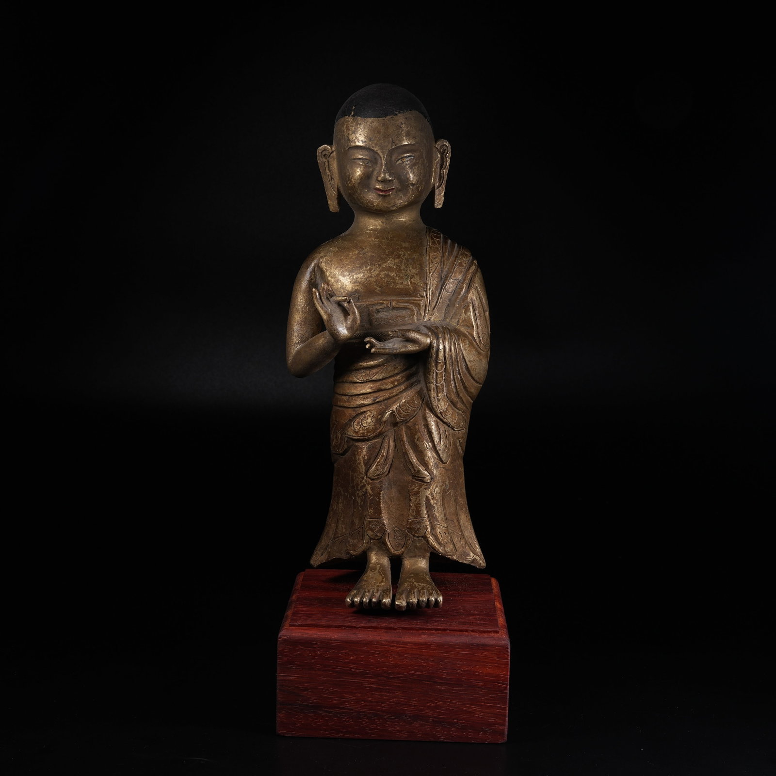 A GILDED BRONZE STANDING STATUE OF ANANDA: Gilded Bronze Standing Statue of Ananda