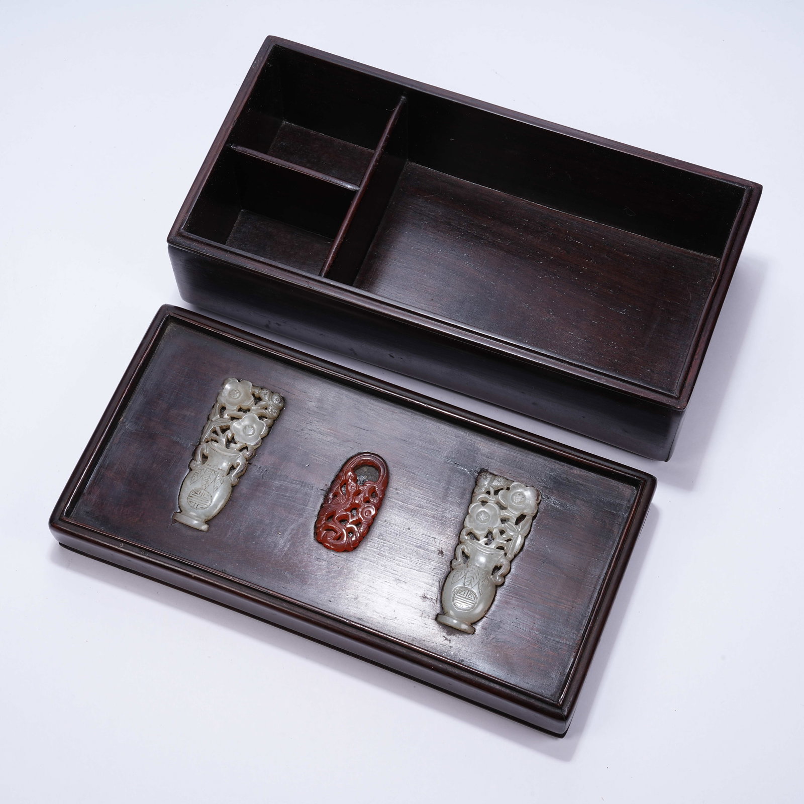 A SQUARE LIDDED BOX WITH ANTIQUE MOTIFS AND GEMSTONE INLAY ON HUANGHUALI: Square Lidded Box with Antique Motifs and Gemstone Inlay on Huanghuali