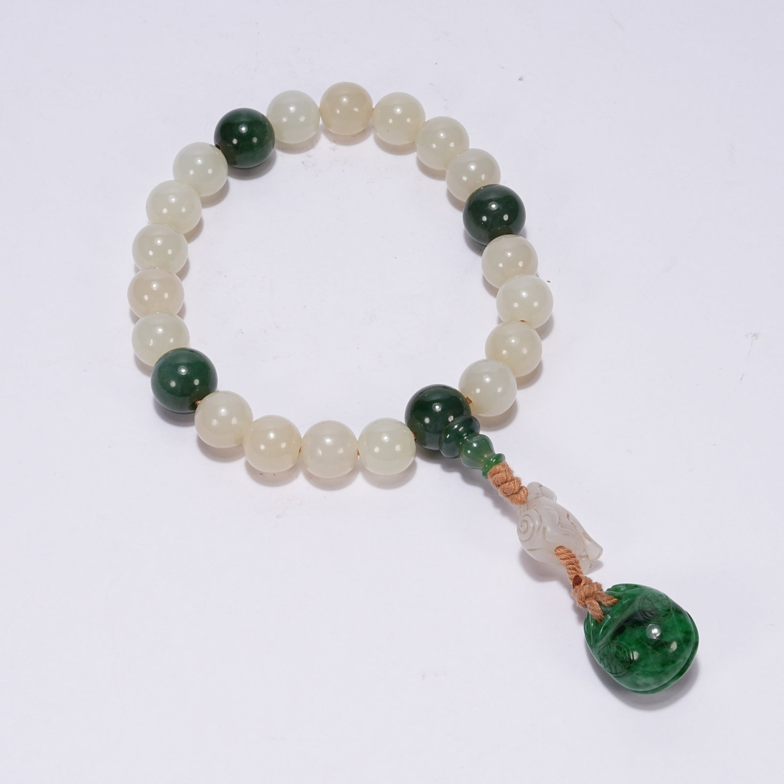 A SET OF NEPHRITE HANDHELD ORNAMENTS (1 of 8)
