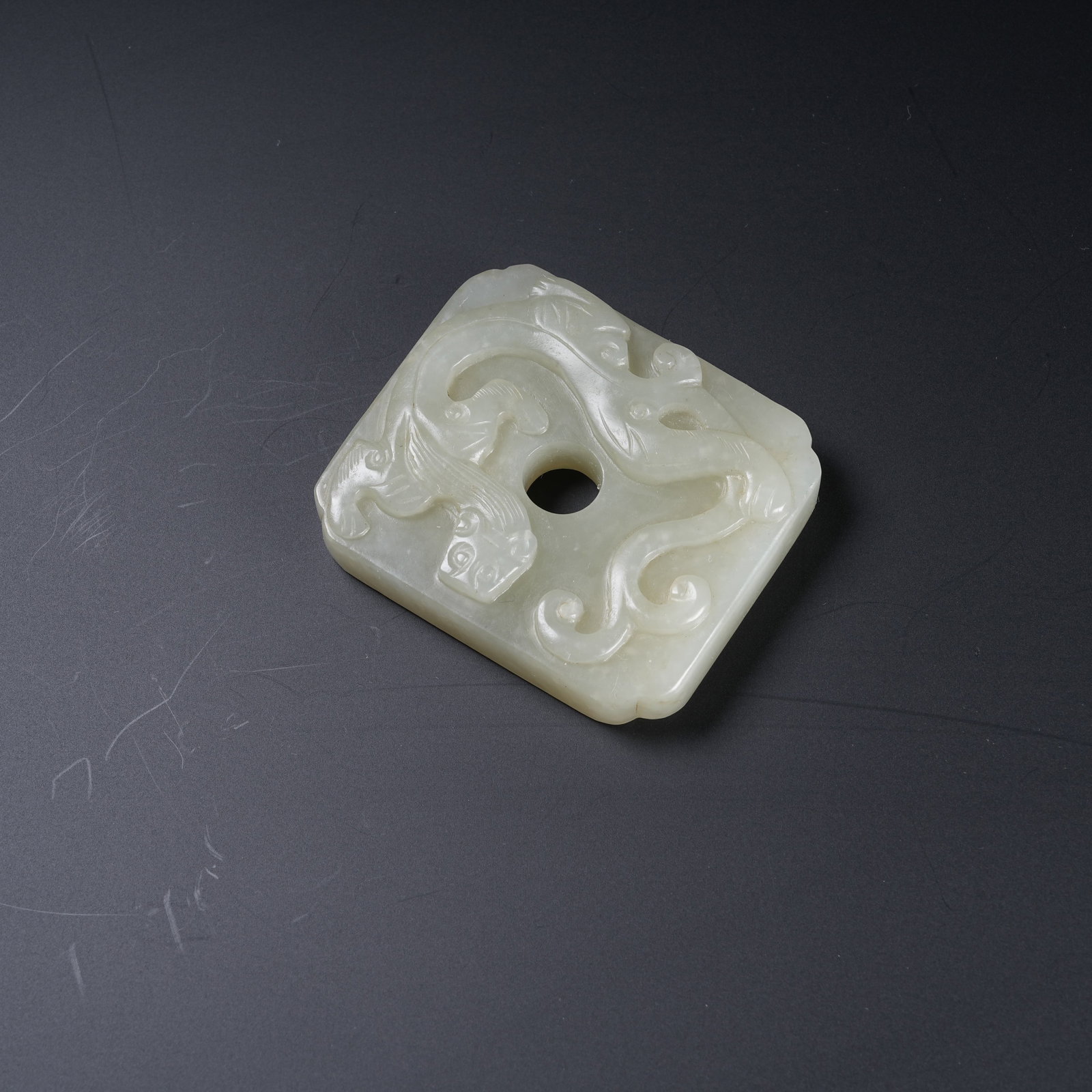 A HETIAN JADE PENDANT CARVED WITH CHI DRAGON PATTERNS: Hetian Jade Pendant Carved with Chi Dragon Patterns