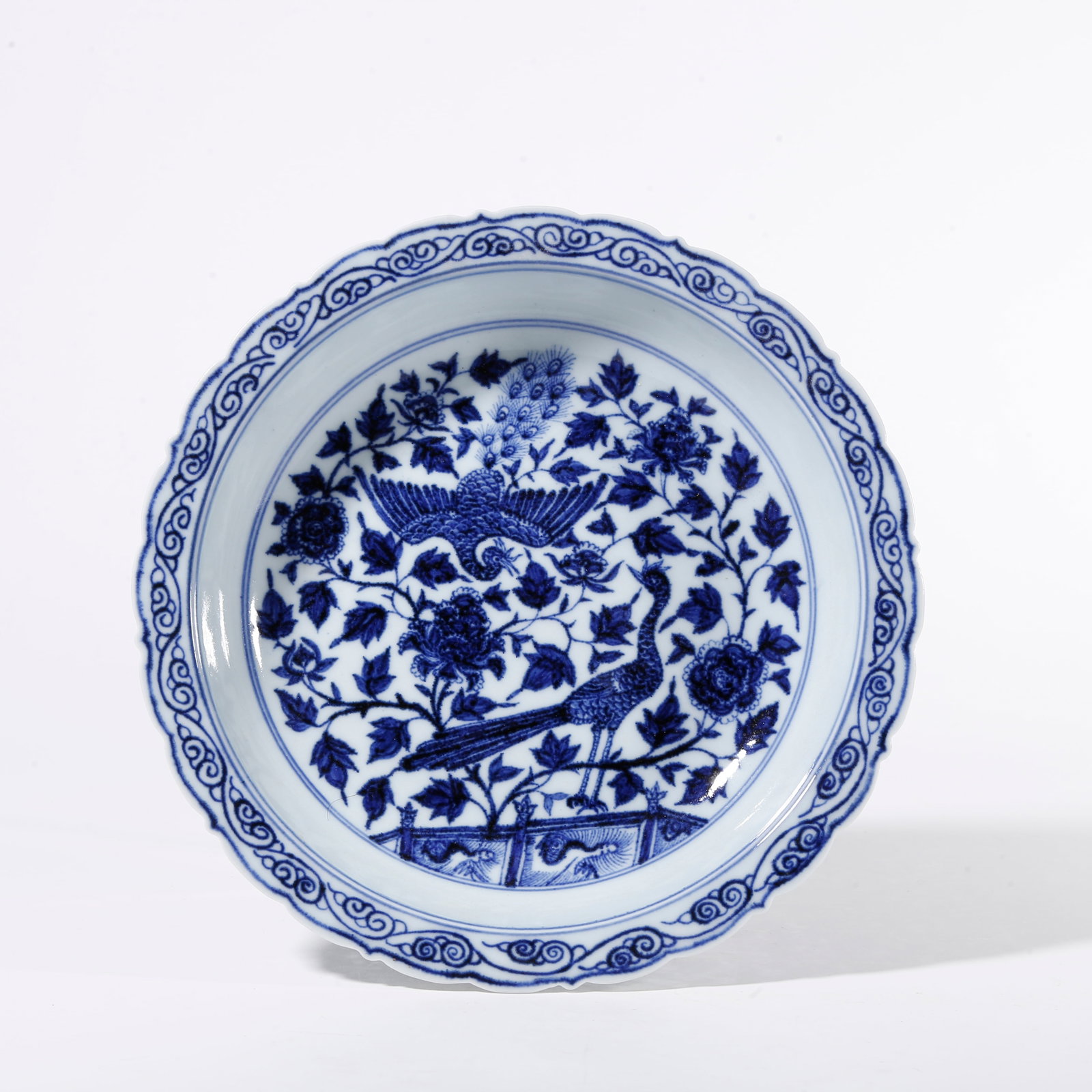 A BLUE AND WHITE PLATE WITH PEACOCK PATTERN (1 of 9)