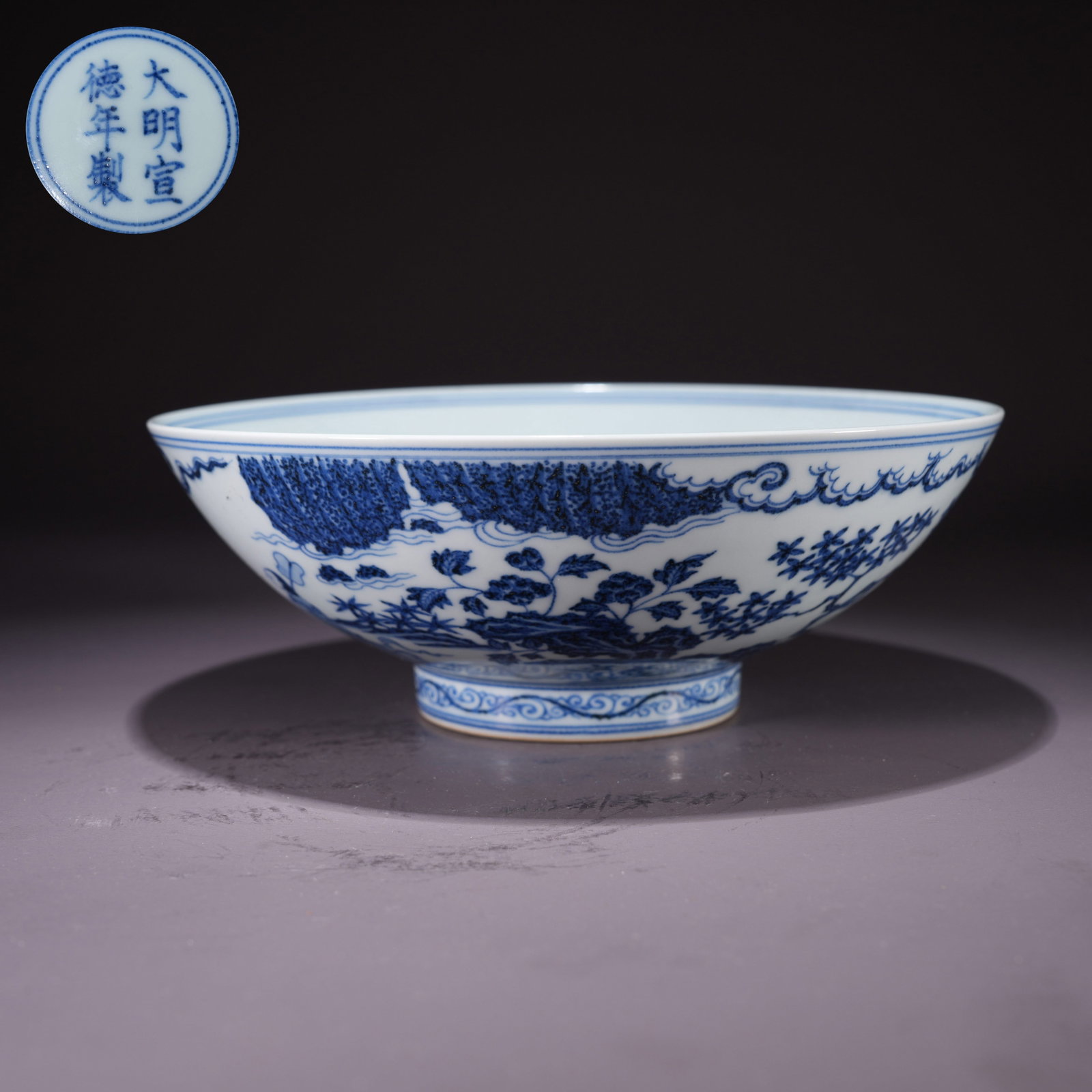 A LARGE BLUE-AND-WHITE BOWL WITH COURT LADY IN GARDEN SCENE: Large Blue-and-White Bowl with Court Lady in Garden Scene