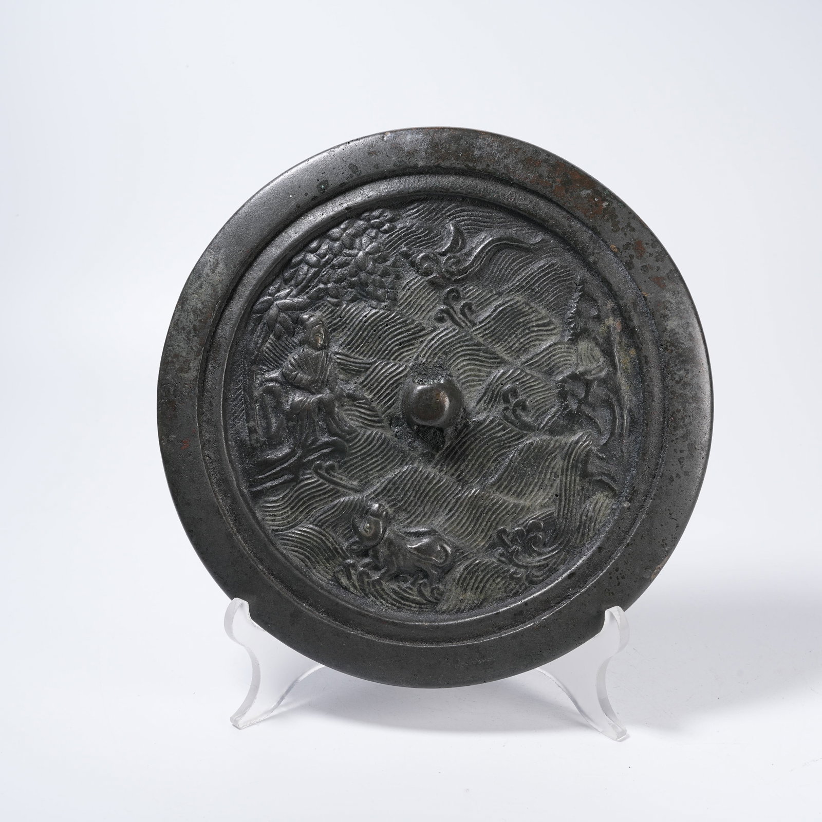 A BRONZE MIRROR WITH HUMAN FIGURE PATTERNS: Bronze Mirror with Human Figure Patterns