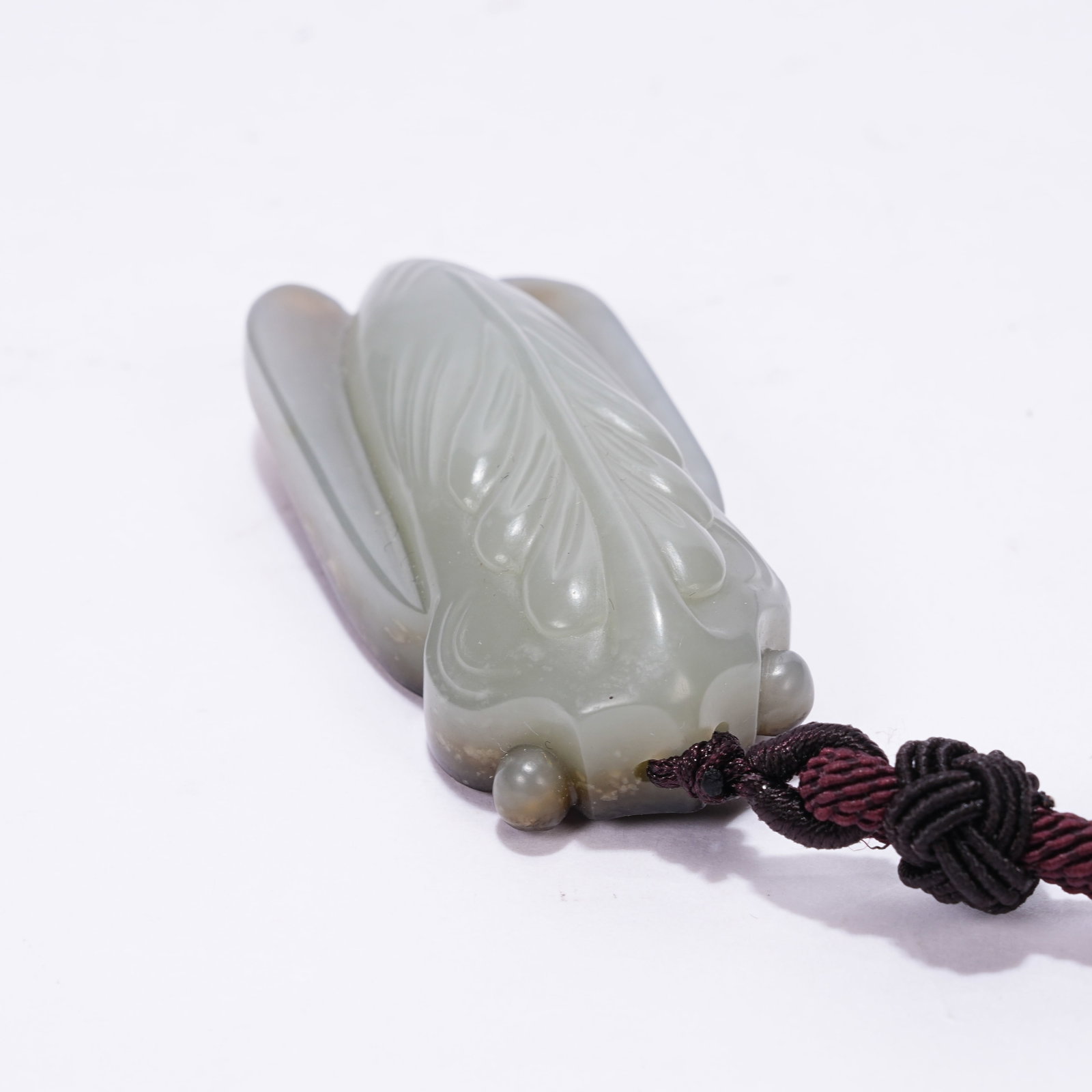 A HETIAN JADE CICADA PENDANT: Hetian Jade Cicada Pendant