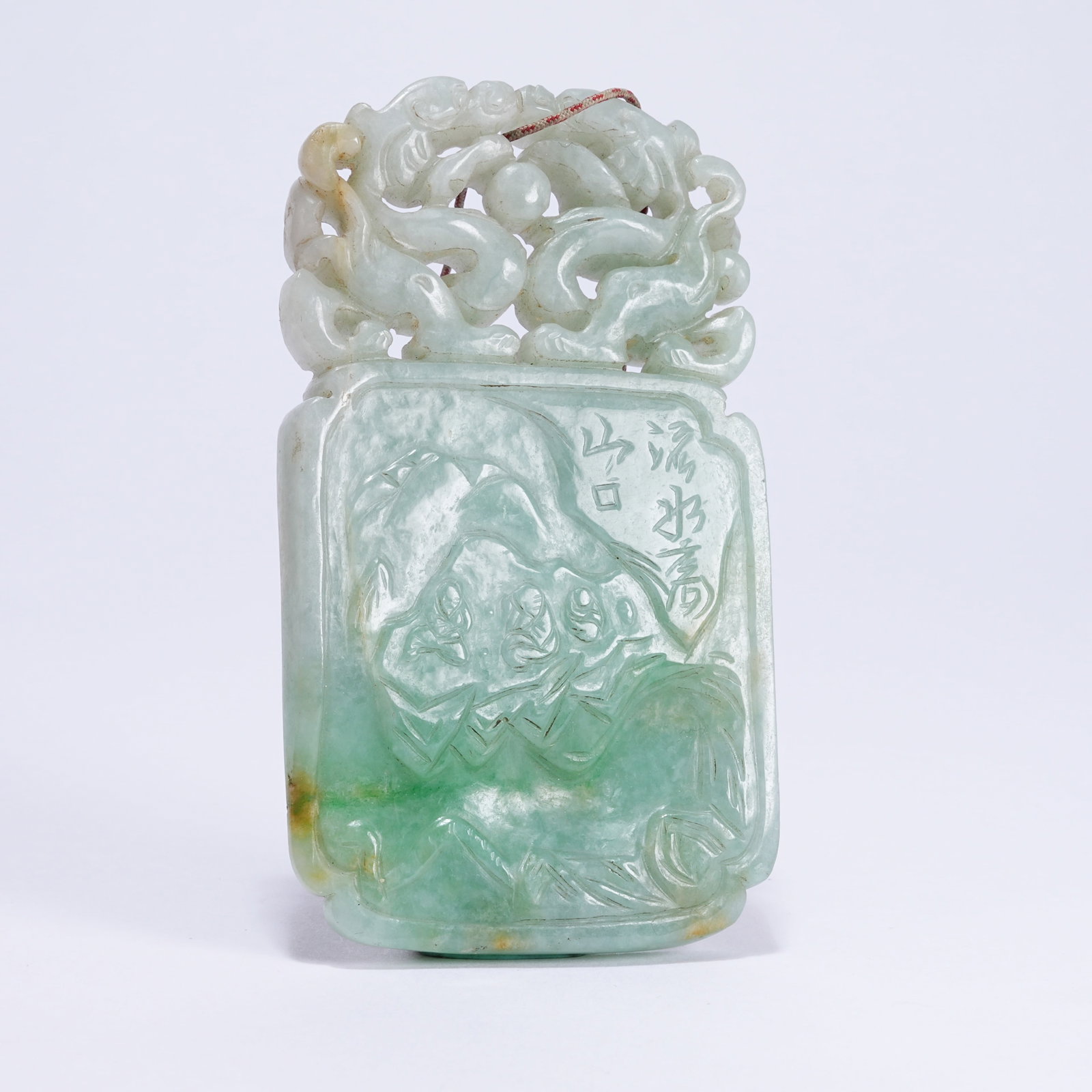 A JADEITE PLAQUE WITH PINE AND CRANE LONGEVITY PATTERN: Jadeite Plaque with Pine and Crane Longevity Pattern