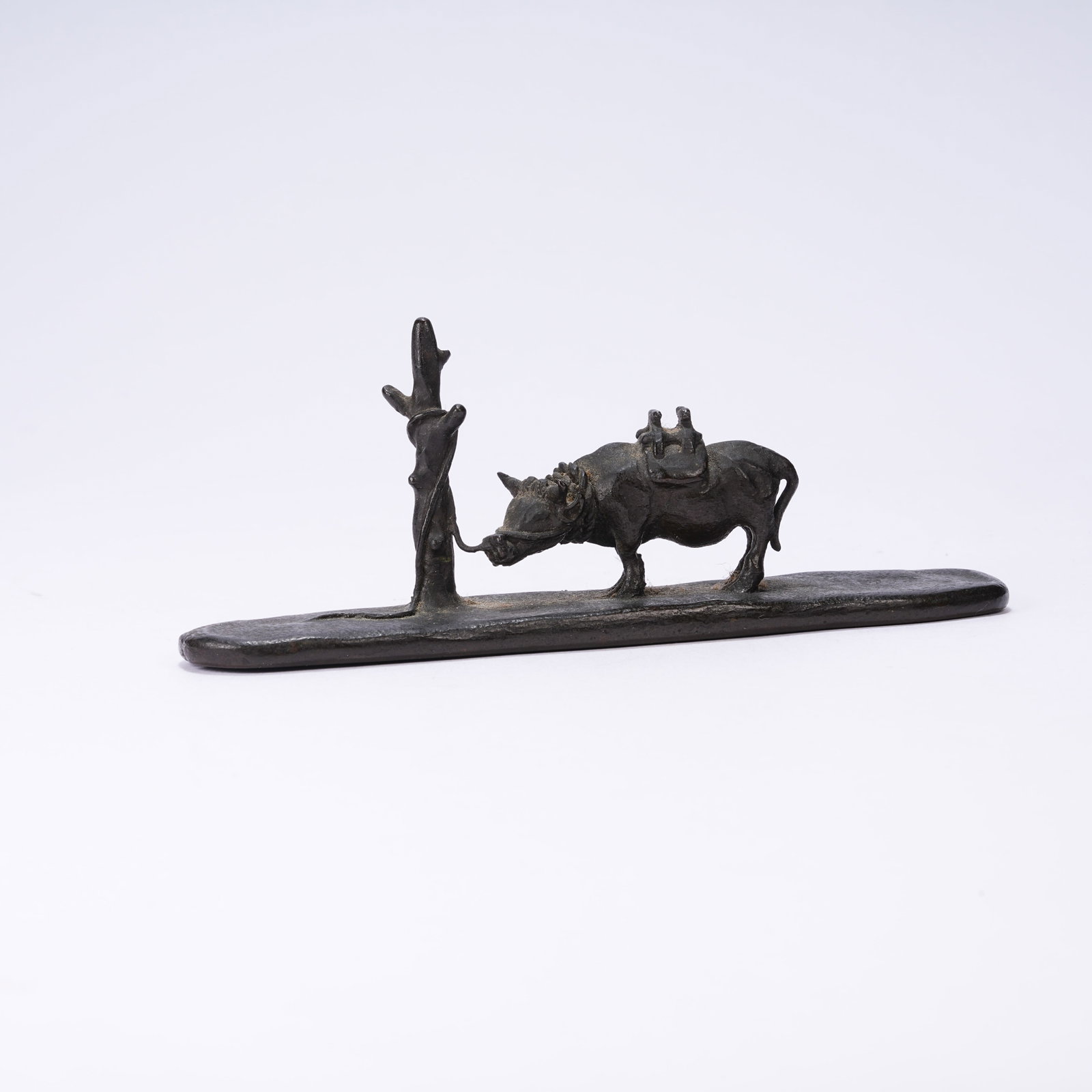 A BRONZE BRUSH REST IN COW-HERDING DESIGN (1 of 8)
