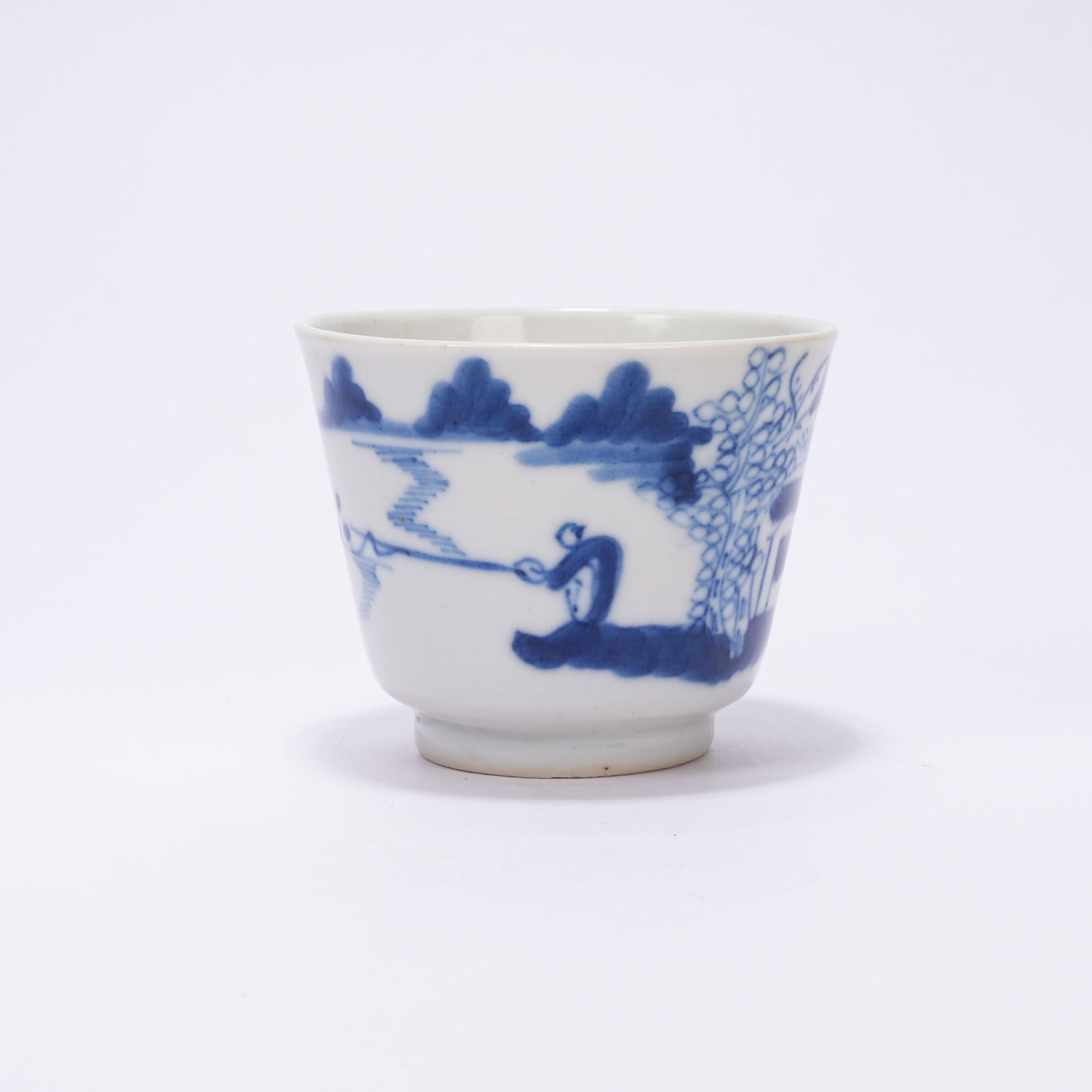 A BLUE AND WHITE CUP WITH LANDSCAPE AND FIGURE PATTERN: Blue and White Cup with Landscape and Figure Pattern