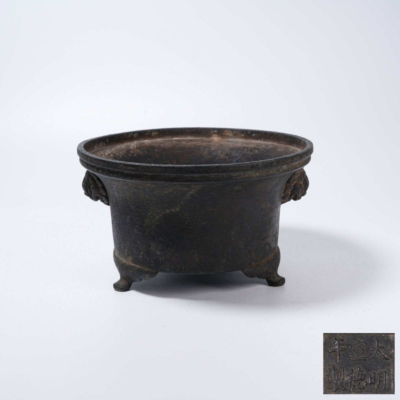 A BRONZE RITUAL CUP CENSER WITH BEAST HANDLES: Bronze Ritual Cup Censer with Beast Handles