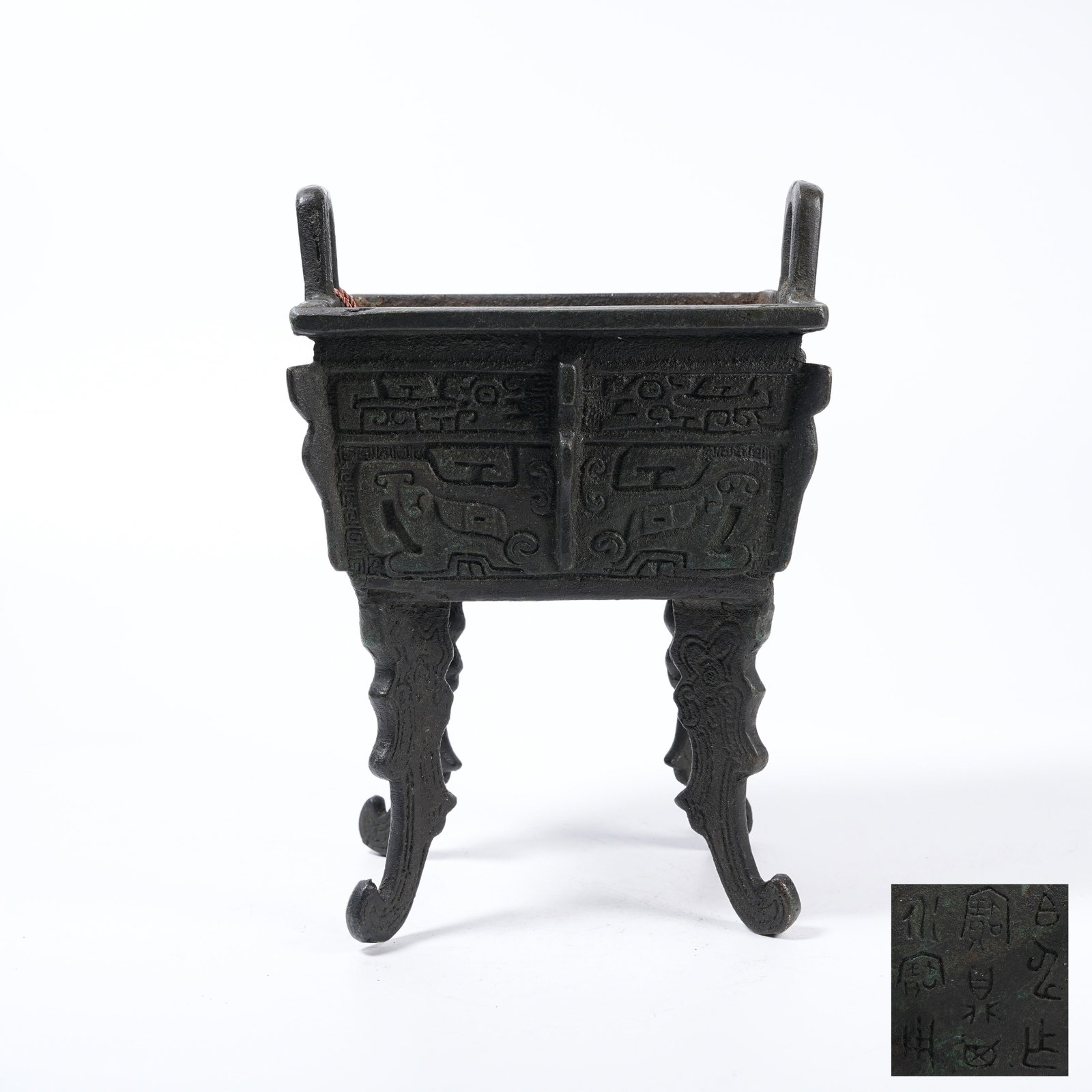 A BRONZE DING-STYLE CENSER WITH BEAST MASK PATTERNS AND RAISED RIBS: Bronze Ding-style Censer with Beast Mask Patterns and Raised Ribs