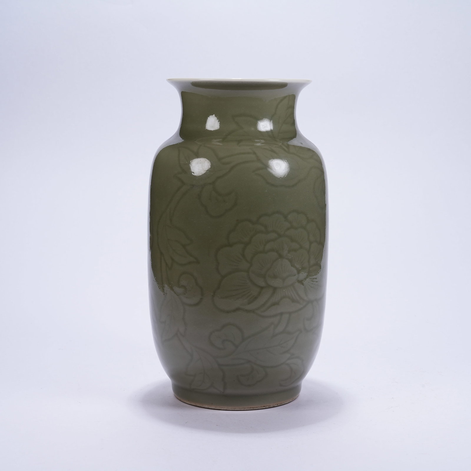 A YAOZHOU KILN VASE WITH CARVED HIDDEN FLORAL PATTERNS: Yaozhou Kiln Vase with Carved Hidden Floral Patterns