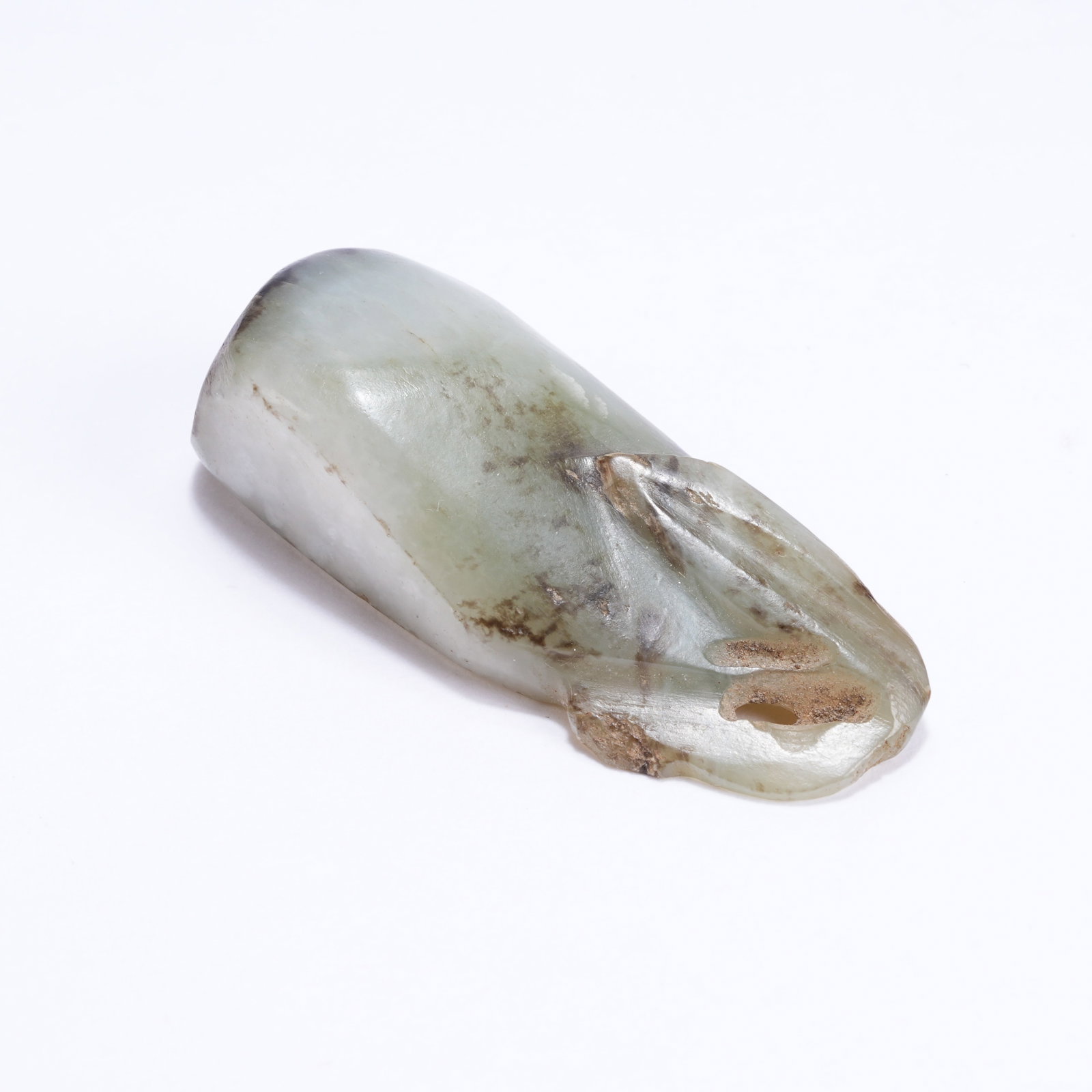 A HETIAN JADE IRREGULAR SHAPED PENDANT: Hetian Jade Irregular Shaped Pendant
