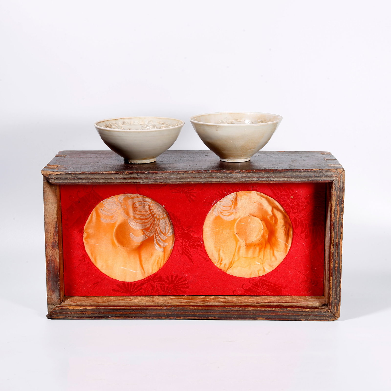 A DING KILN CUP WITH DRAGON AND PHOENIX PATTERNS (PAIR): Ding Kiln Cup with Dragon and Phoenix Patterns (Pair)