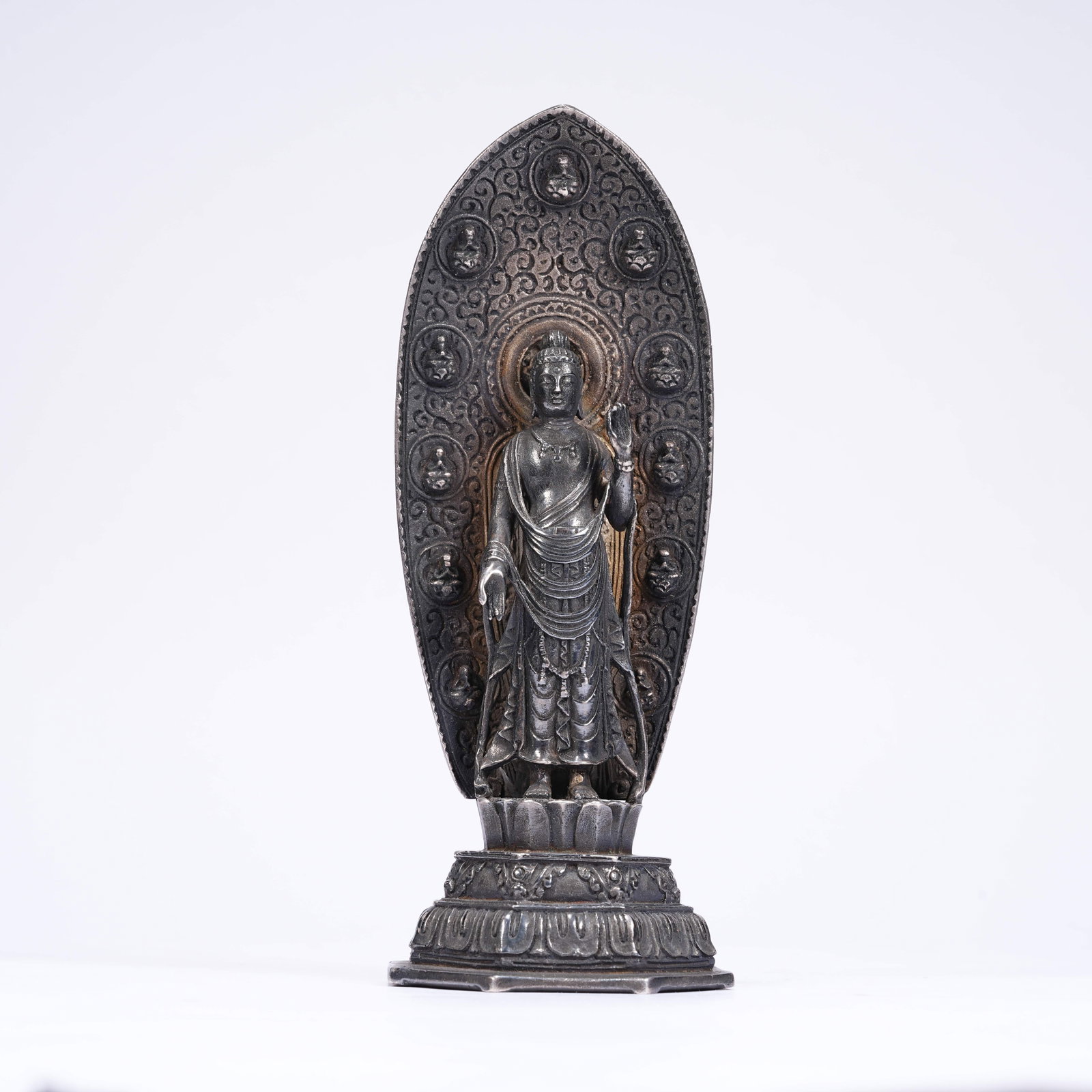 A SILVER STANDING STATUE OF SAKYAMUNI: Silver Standing Statue of Sakyamuni