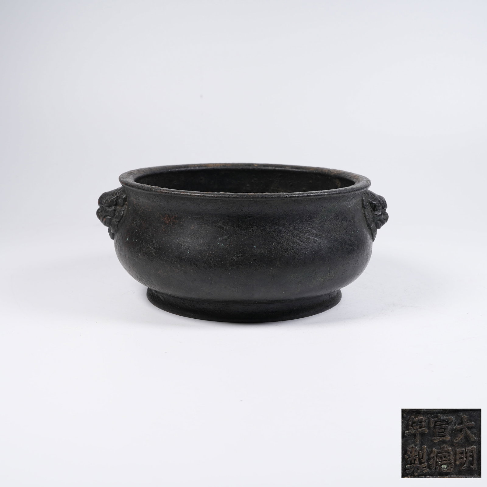 A BRONZE CENSER WITH LION EARS: Bronze Censer with Lion Ears