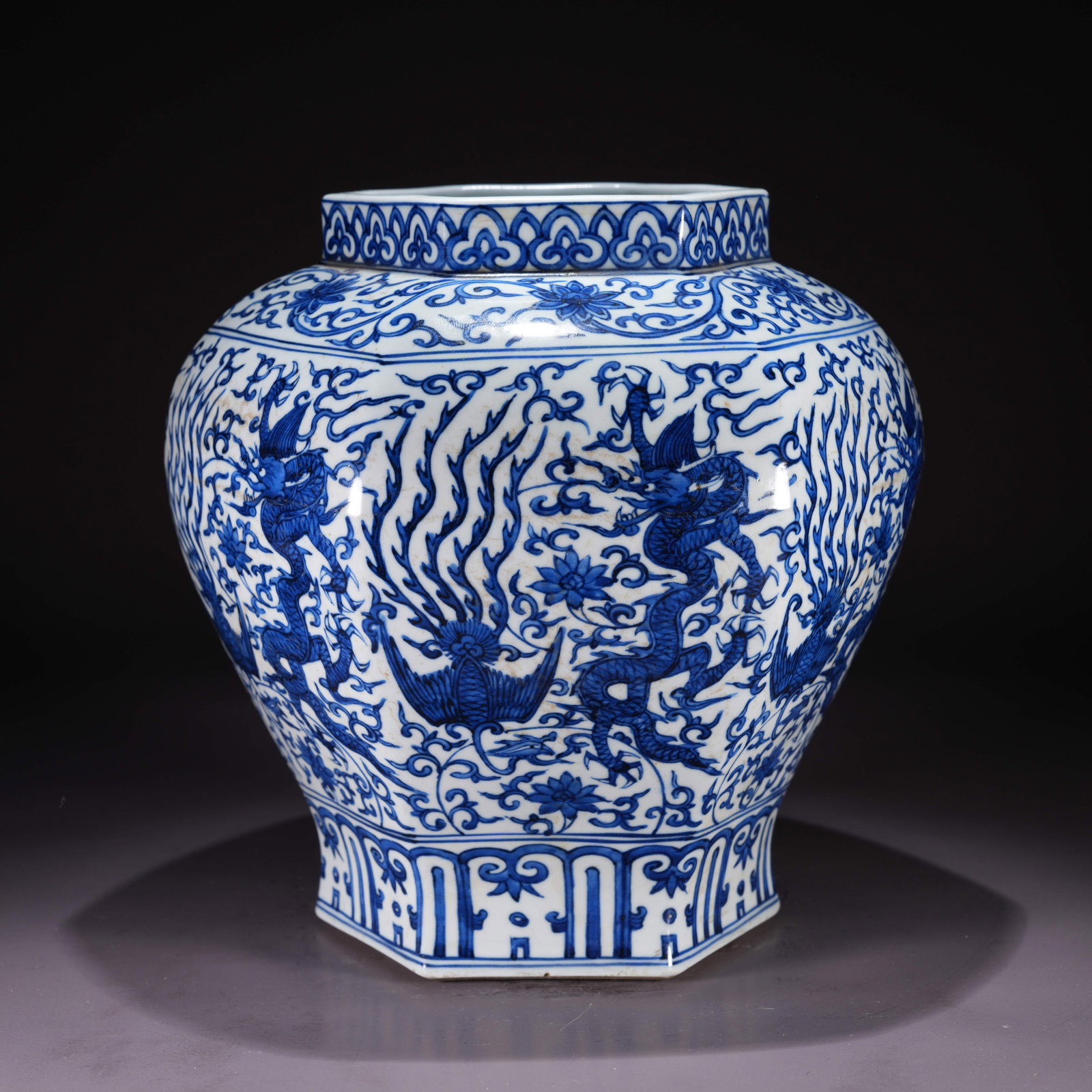 A BLUE-AND-WHITE HEXAGONAL JAR WITH DRAGON AND PHOENIX AMONG FLOWERS MOTIF: Blue-and-White Hexagonal Jar with Dragon and Phoenix Among Flowers Motif