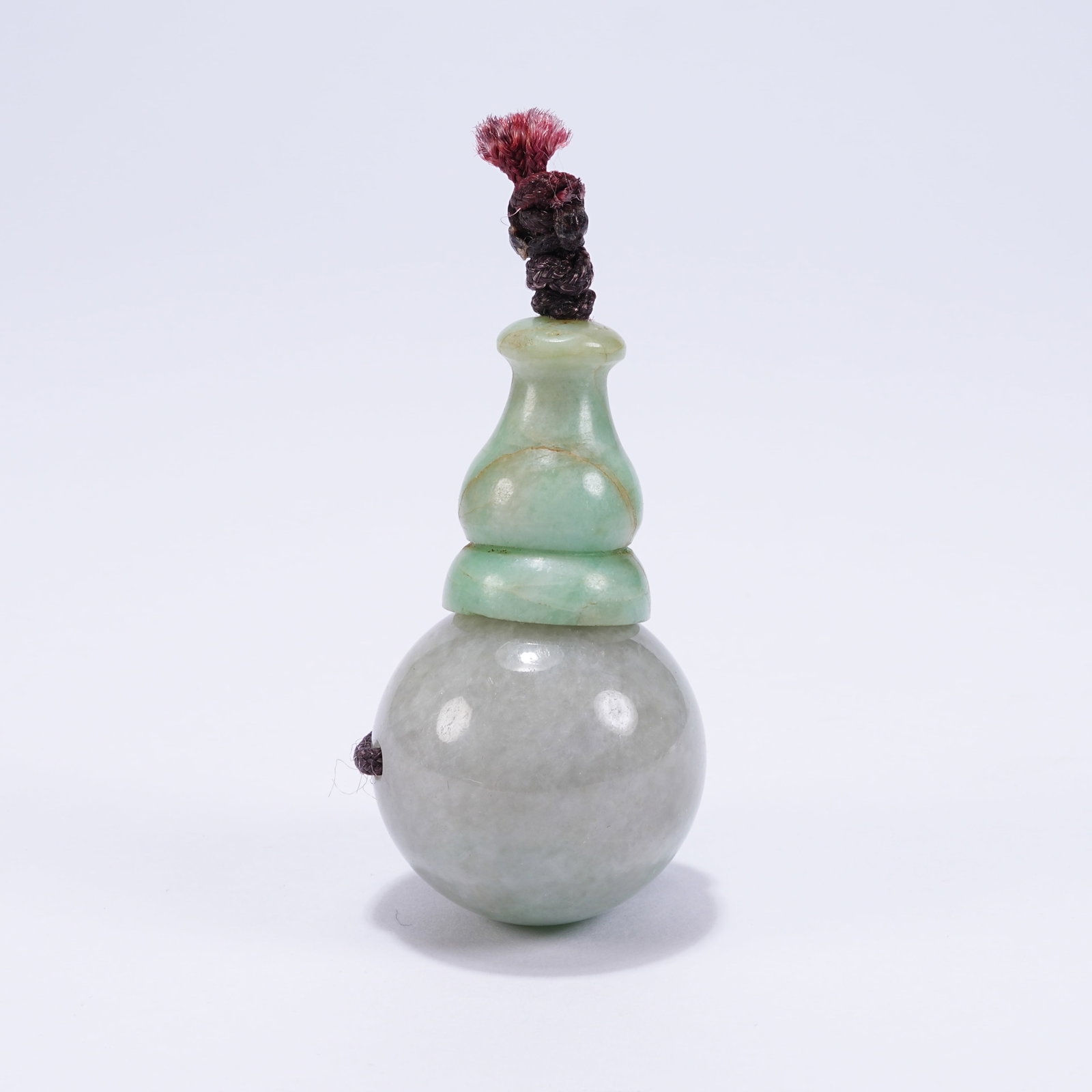 A GROUP OF JADEITE FLOWER PATTERN PENDANTS (1 of 9)
